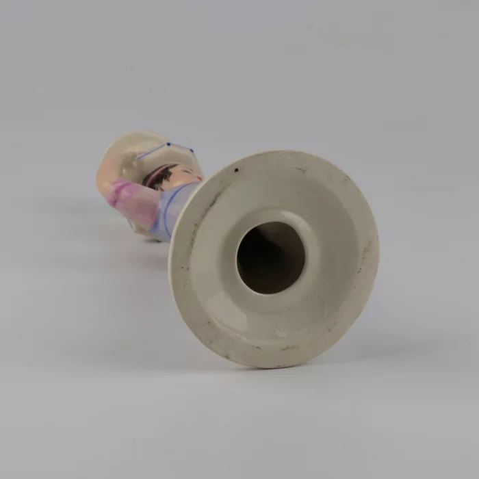 Porcelain candlestick-figure Russian peasant woman.