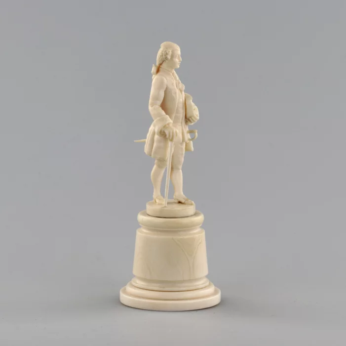 Ivory figure of a gentleman in a cocked hat.