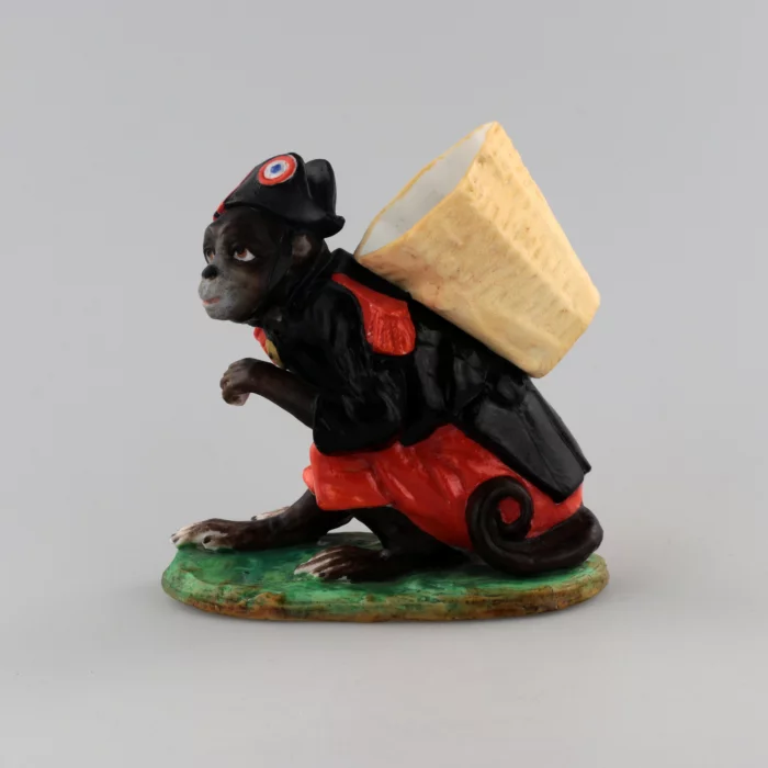 PORCELAIN FIGURE-CONTAINER MONKEY AS NAPOLEON. THURINGIA, GERMANY. LATE 19TH TO EARLY 20TH CENTURY.