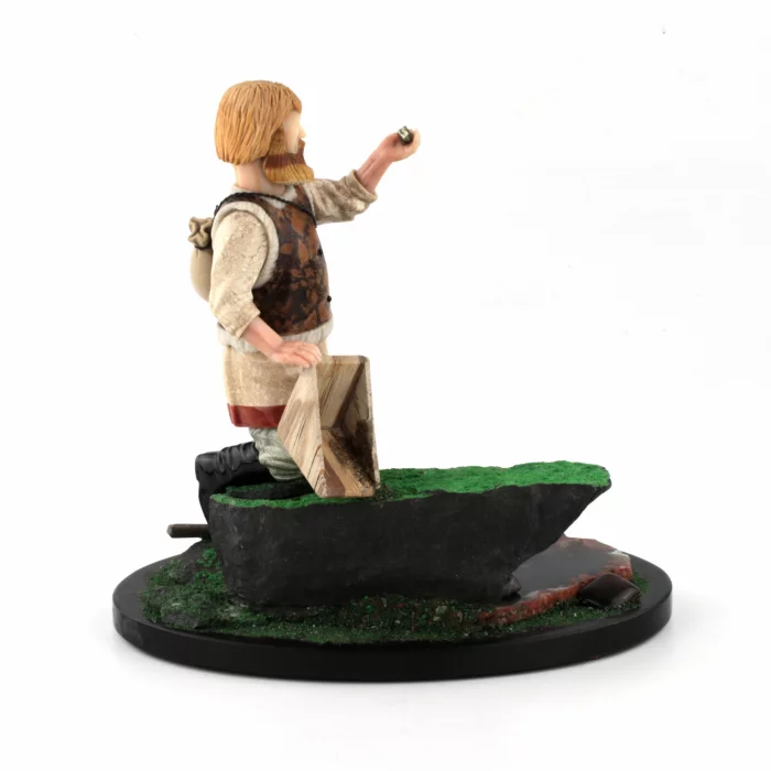 Figurine taillee dans la pierre Prospecteur.
