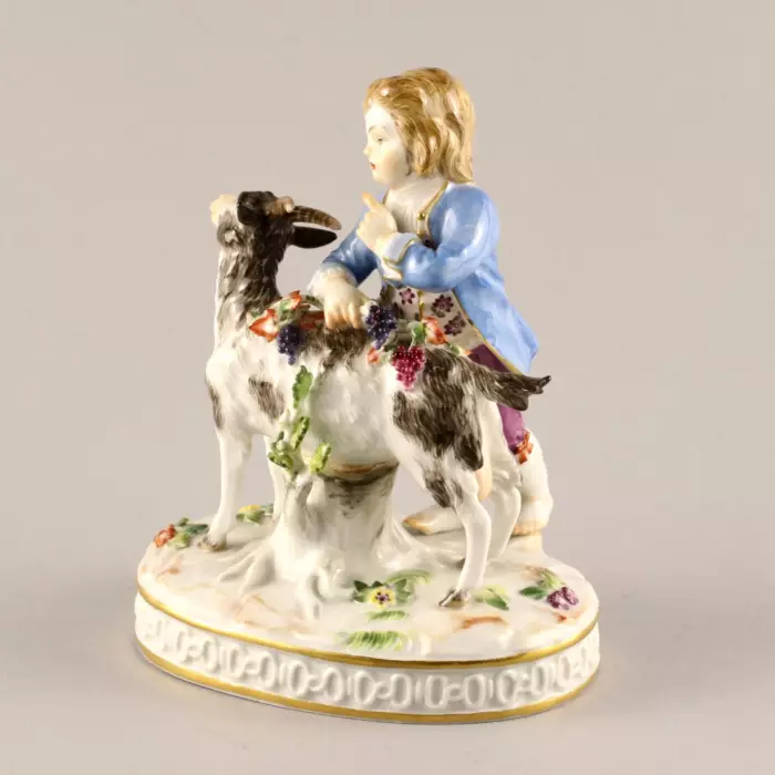 MEISSEN PORCELAIN FIGURE BOY WITH A GOAT. ALLEGORY OF AUTUMN