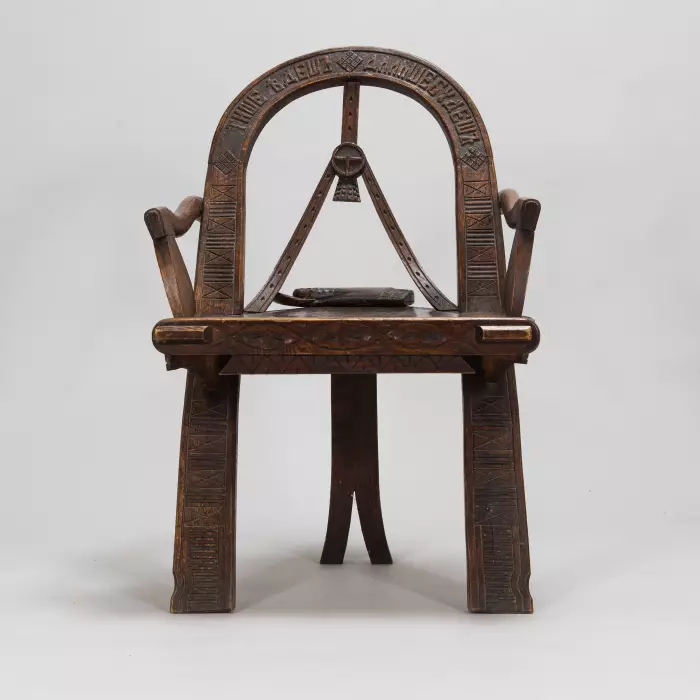 Russian carved armchair Arch, ax and gloves according to the sketch of V.P. Shutov. Russia, late 19th century. 