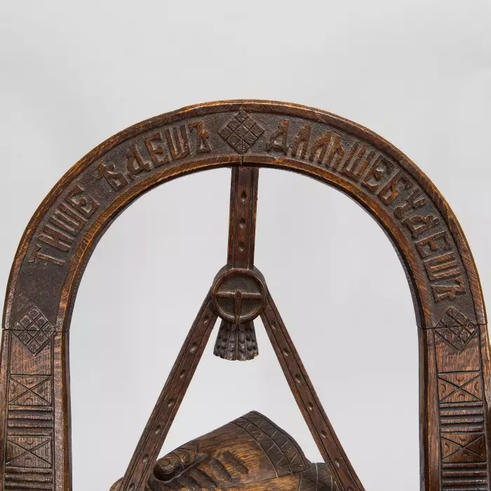 Russian carved armchair Arch, ax and gloves according to the sketch of V.P. Shutov. Russia, late 19th century. 