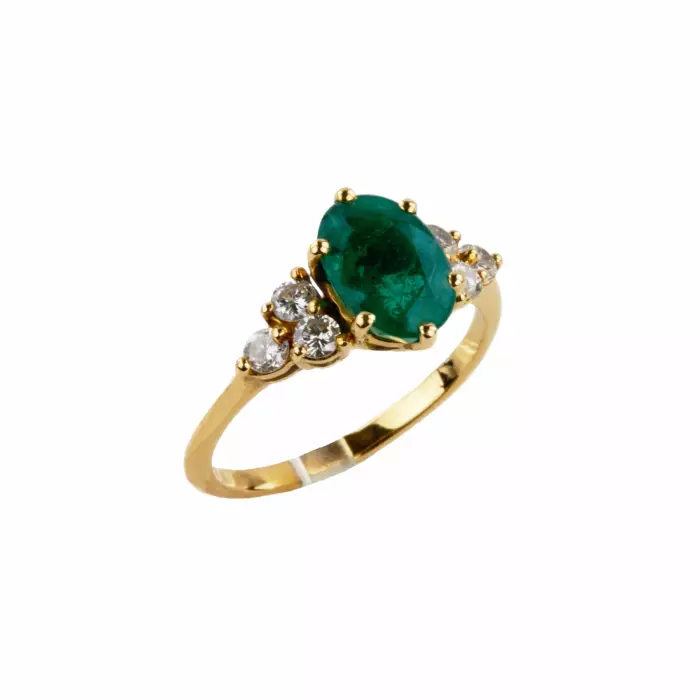 Gold ring with emerald and diamonds. 