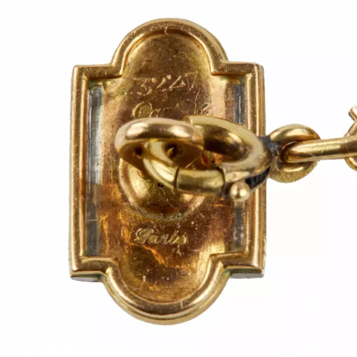 Boutons de manchette Cartier en or avec email et diamants. annees 1920. 