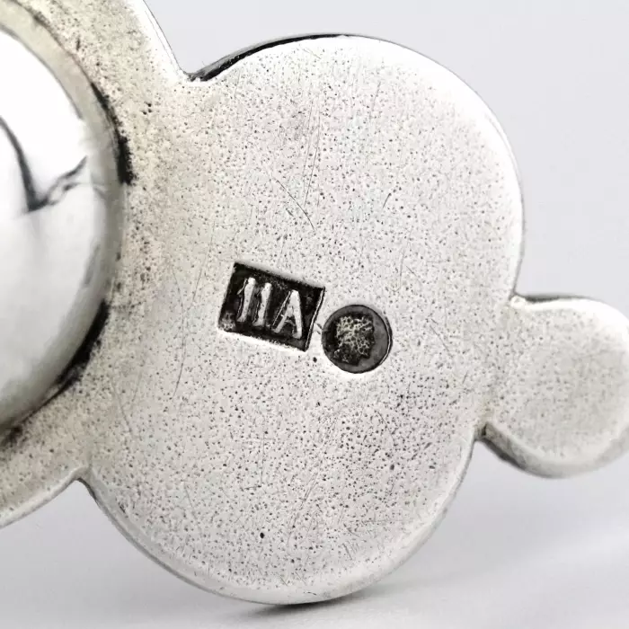RUSSIAN SILVER TEA STRAINER WITH POLYCHROME ENAMEL DECORATION IN THE RUSSIAN ART NOUVEAU STYLE. MOSCOW, 11TH ARTEL, 1908–1917