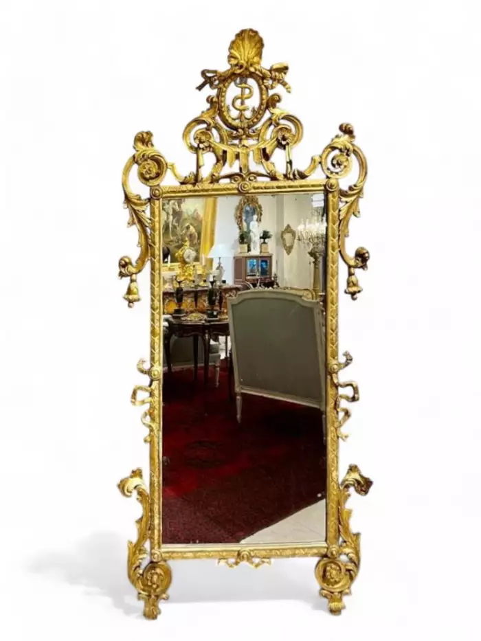 Rare 18th century gilded wood mirror, Italy