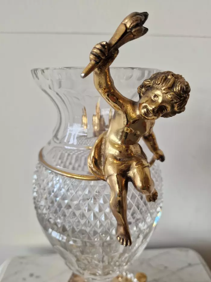 Bohemian crystal vase with bronze puti.