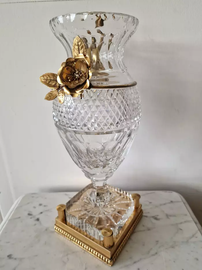 Bohemian crystal vase with bronze puti.