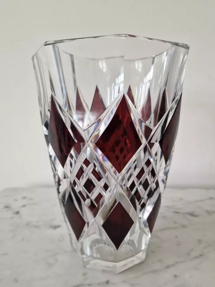 Bohemian crystal vase with bronze puti
