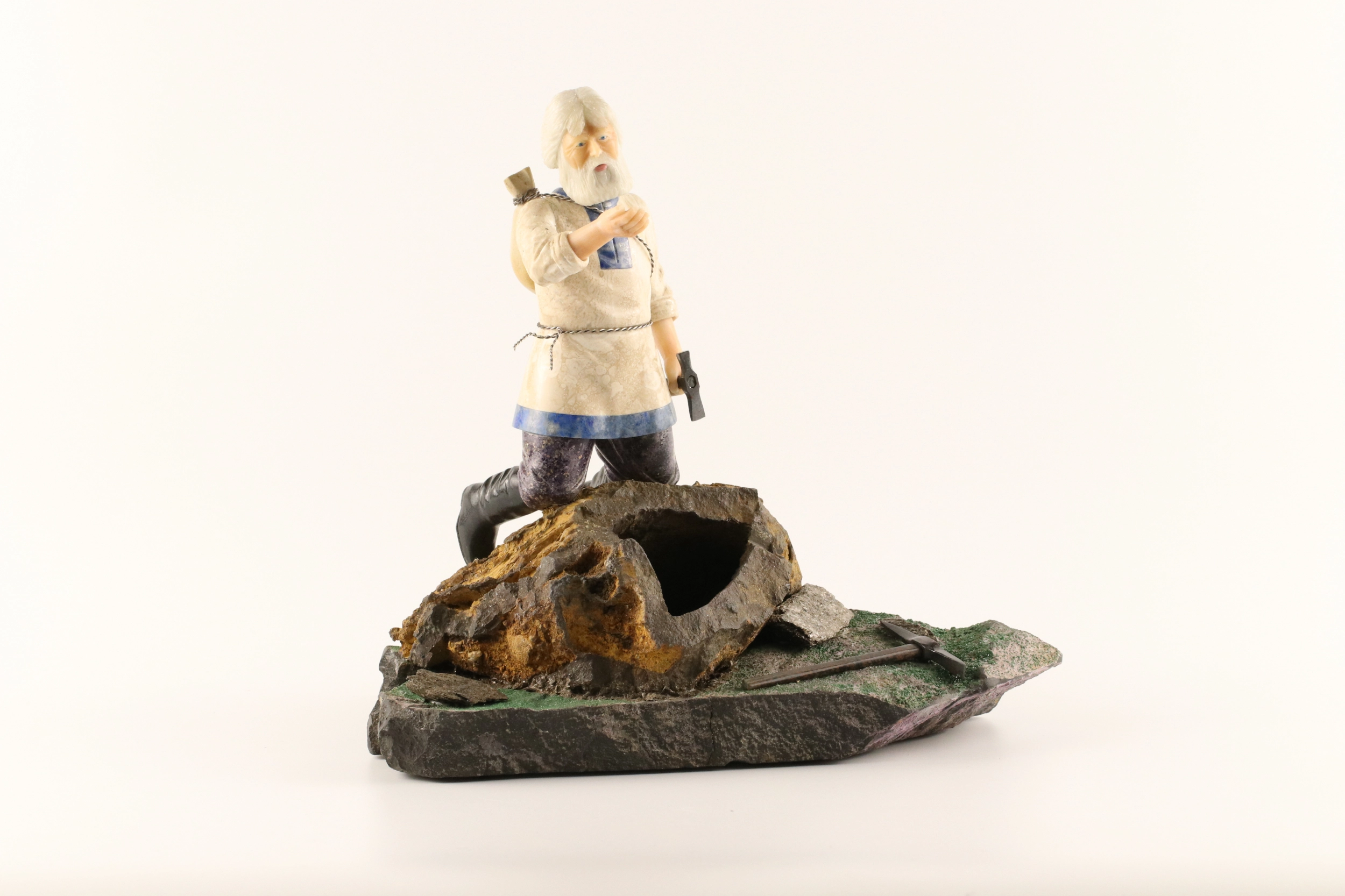 Stone-cut figurine Stone Seeker in Faberge style. 