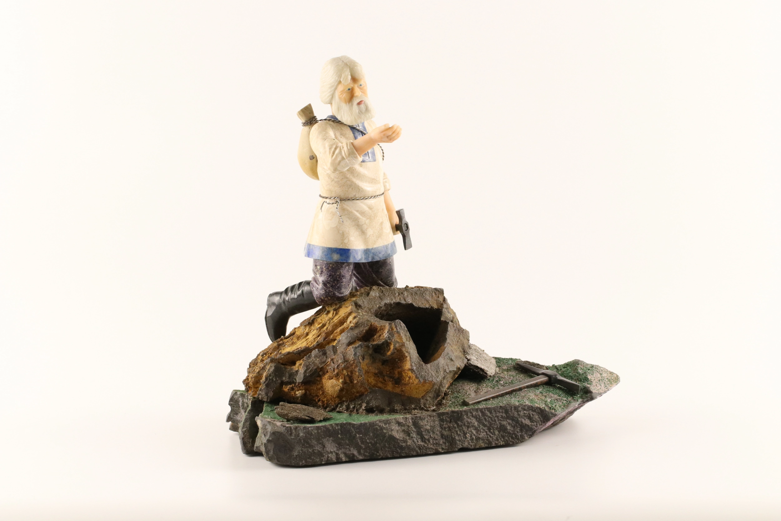 Stone-cut figurine Stone Seeker in Faberge style. 