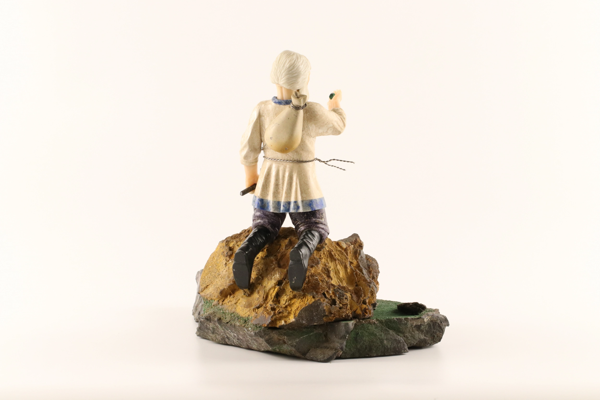 Stone-cut figurine Stone Seeker in Faberge style. 