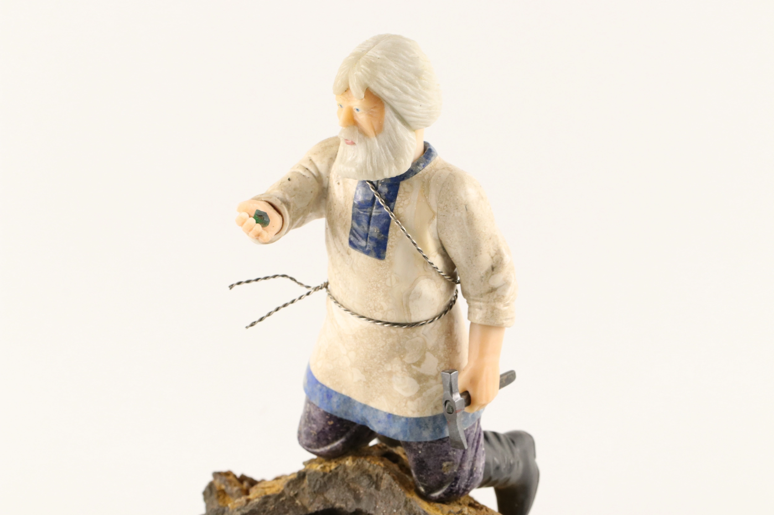 Stone-cut figurine Stone Seeker in Faberge style. 