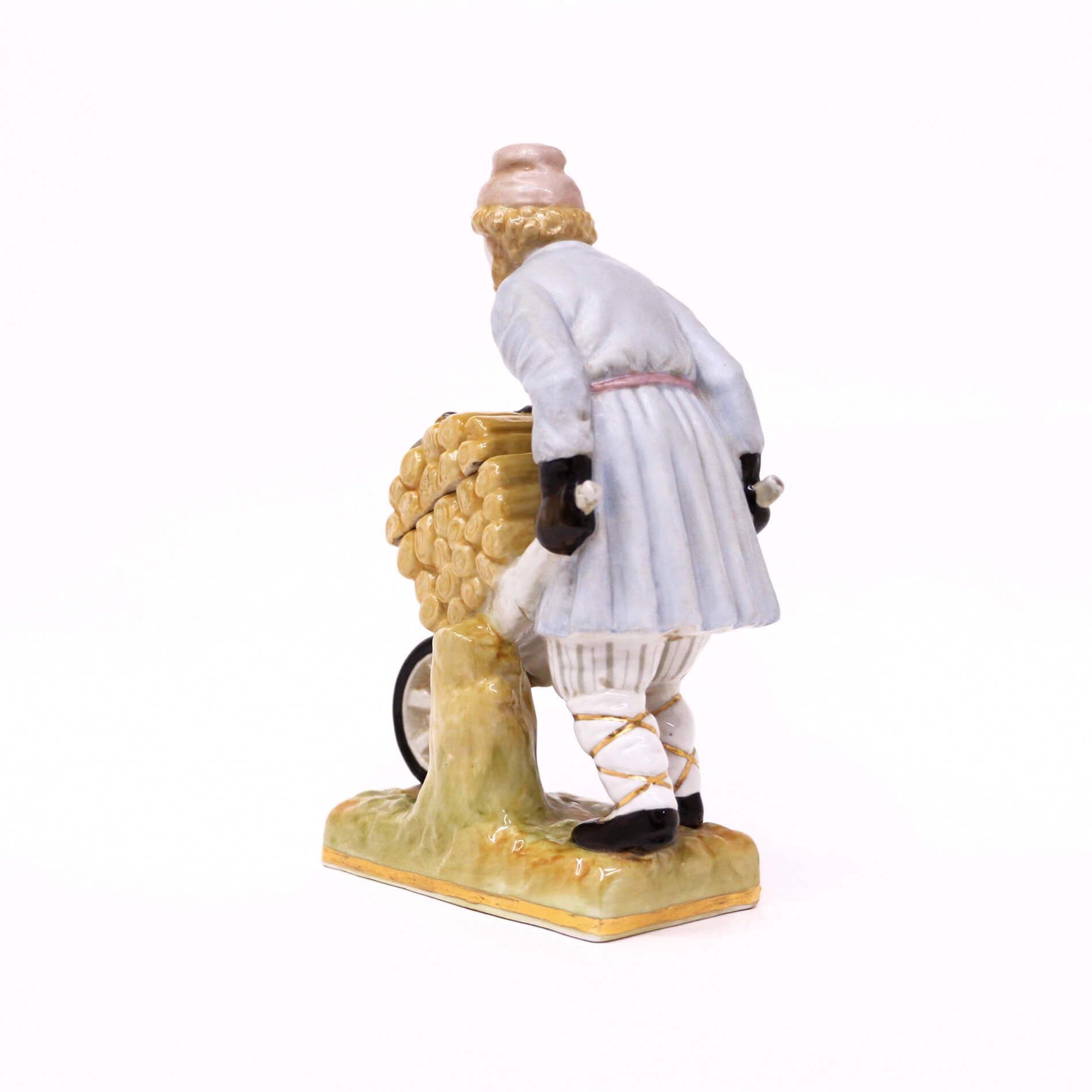 Man with wheelbarrow of firewood