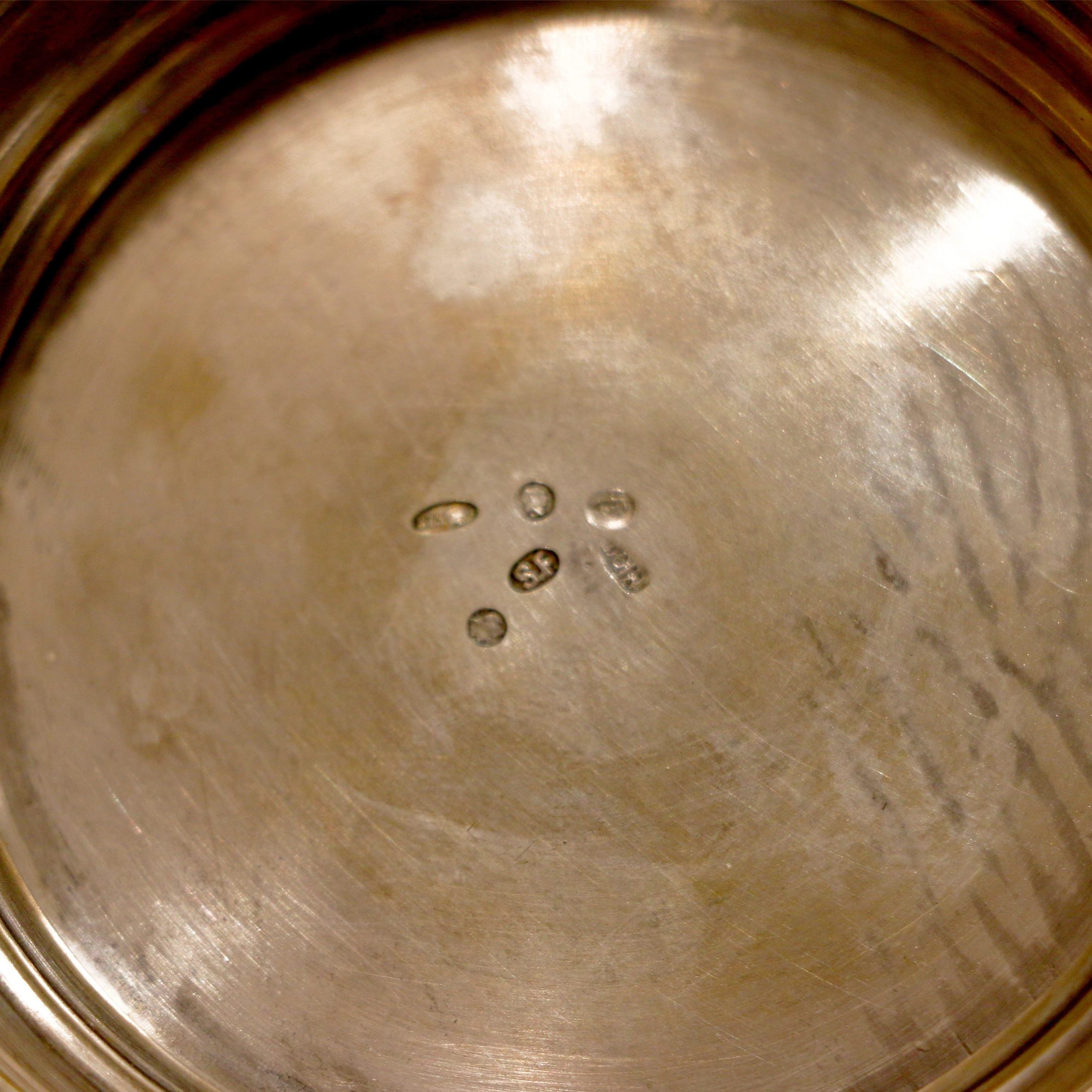 Silver cup holder with a glass.