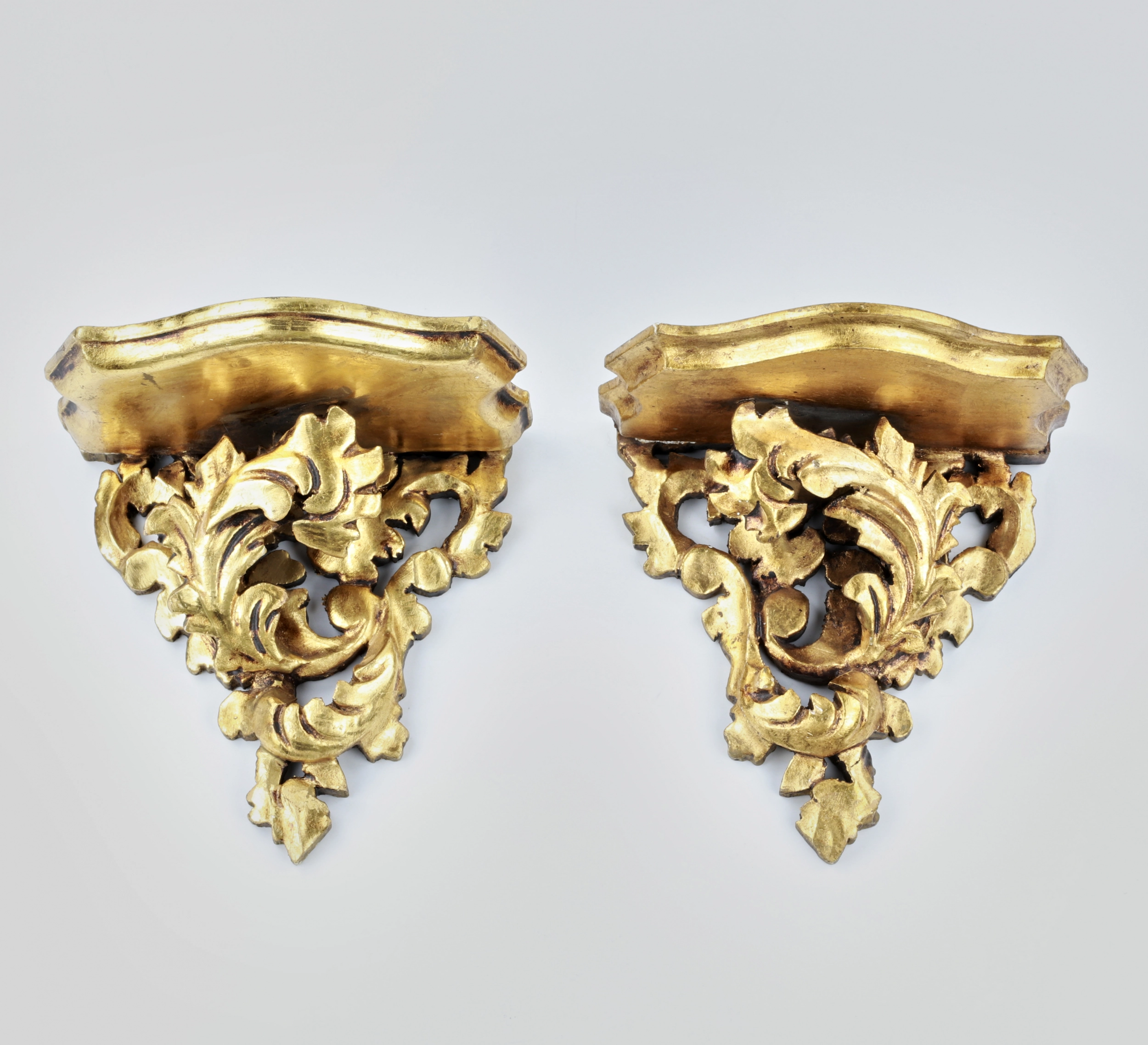 Pair of carved consoles