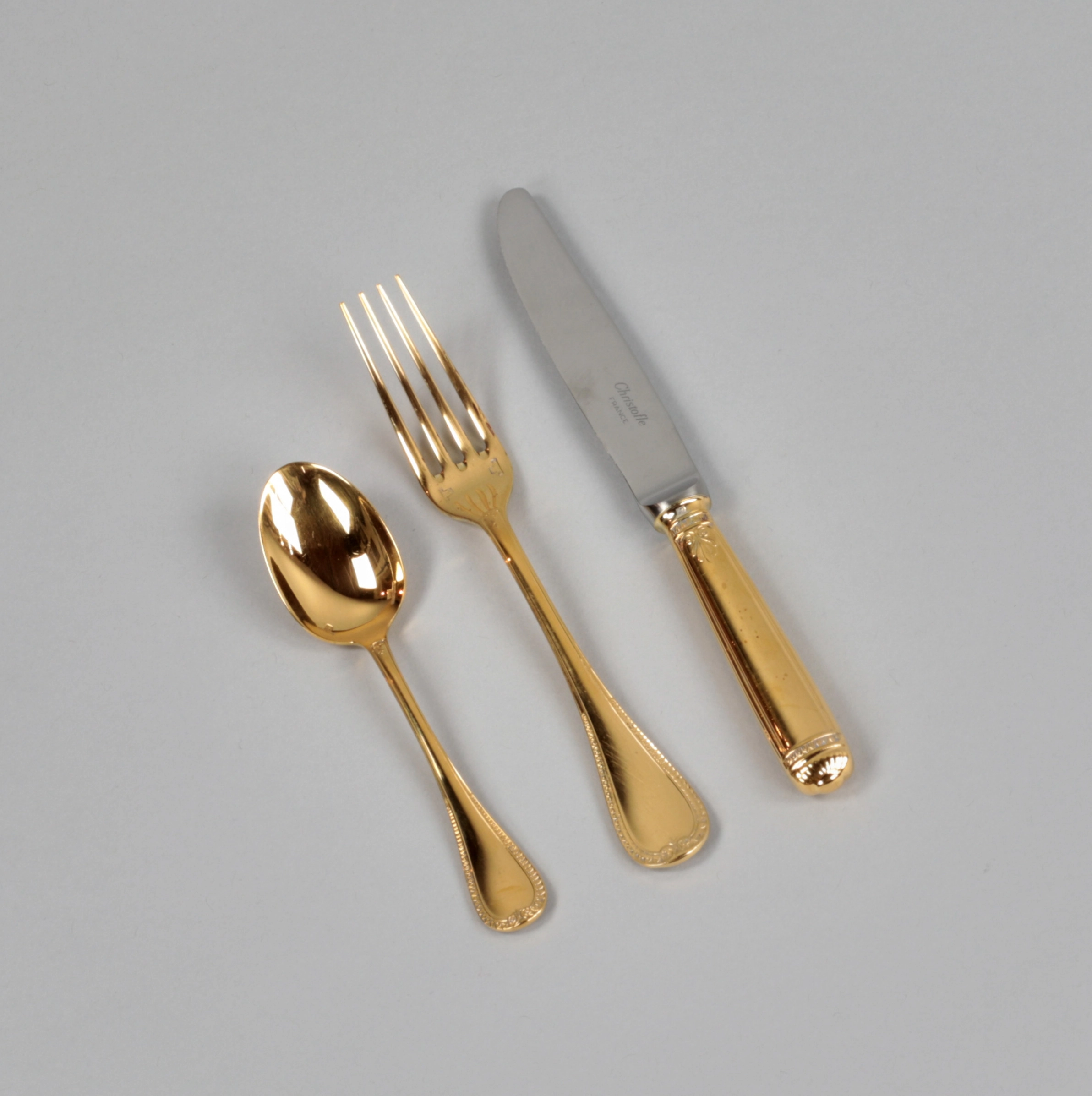 Gilded tableware set from Christofle.