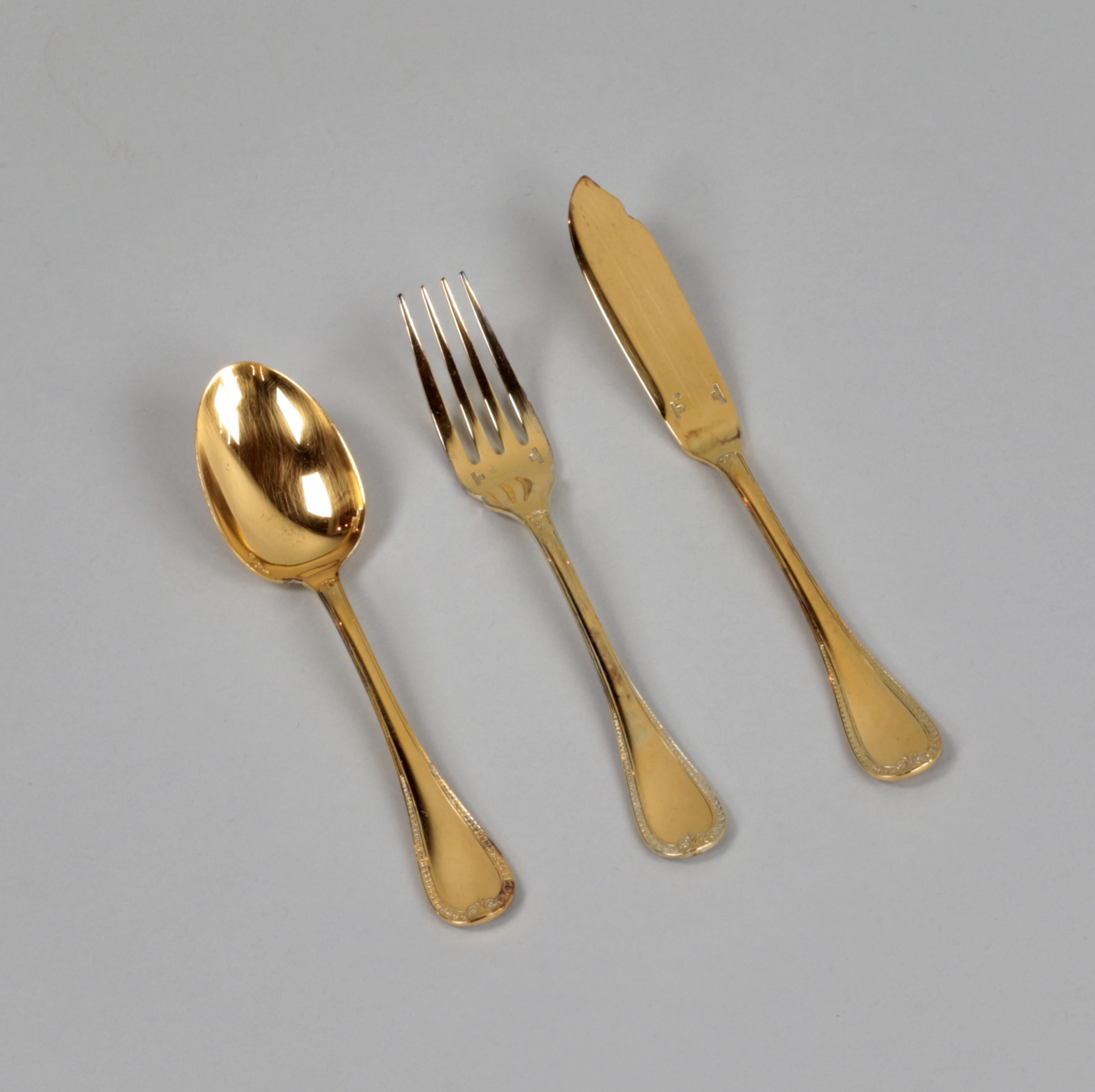 Gilded tableware set from Christofle.