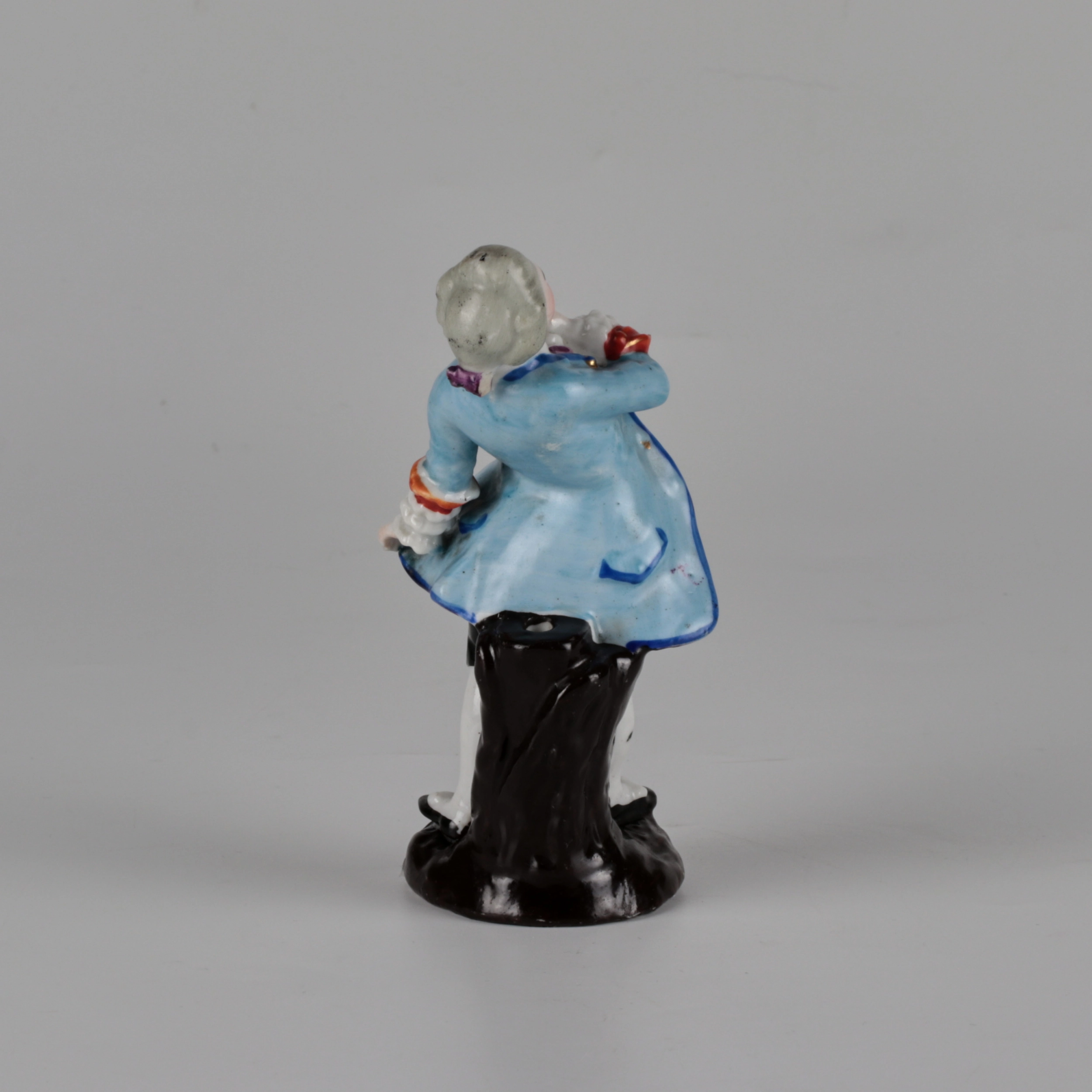 Porcelain figurine of a poet.