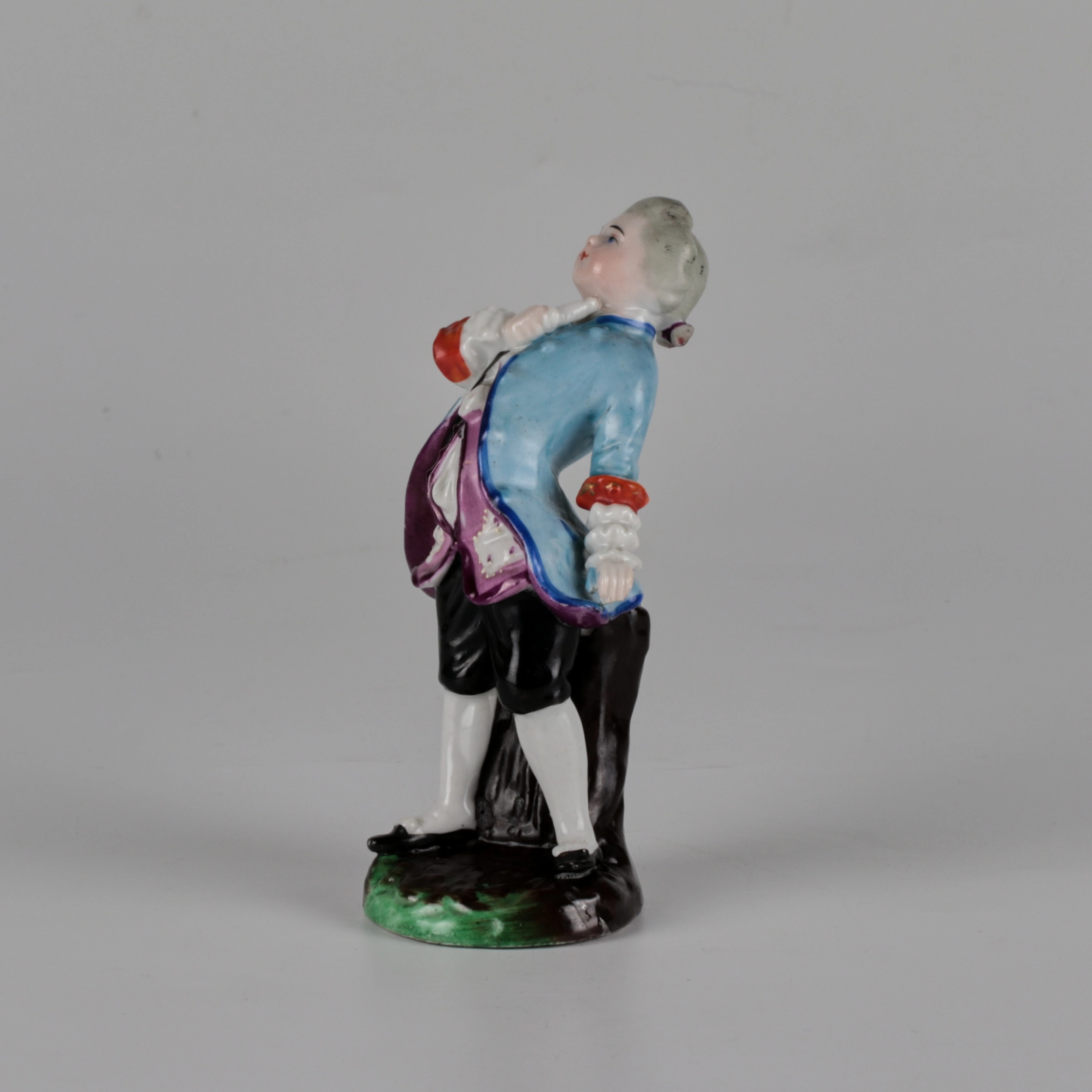 Porcelain figurine of a poet.