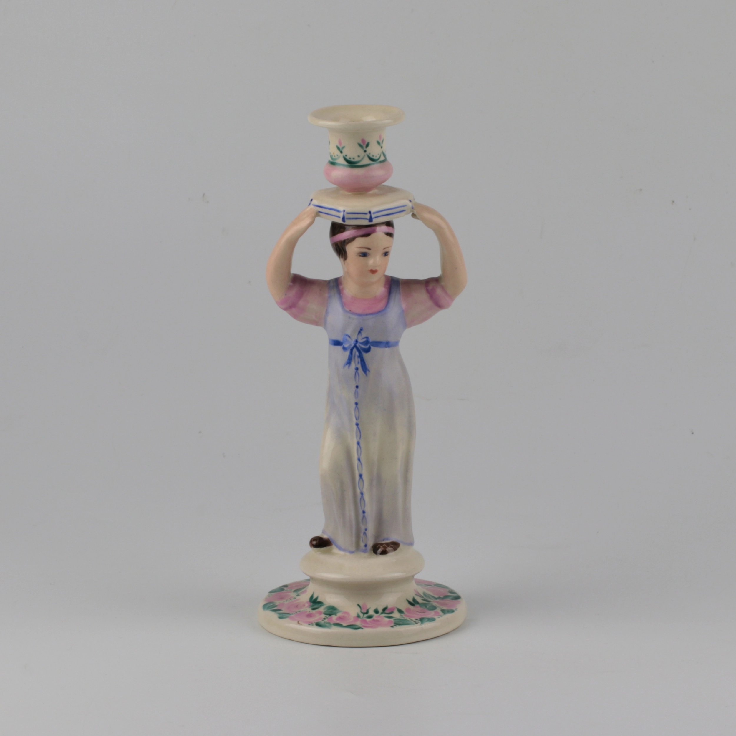 Porcelain candlestick-figure Russian peasant woman.