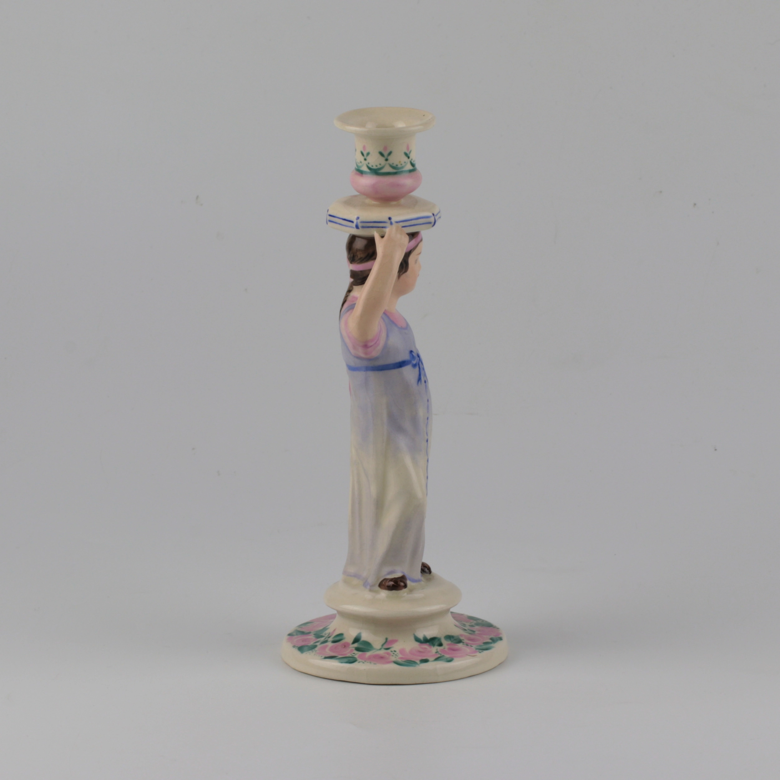 Porcelain candlestick-figure Russian peasant woman.