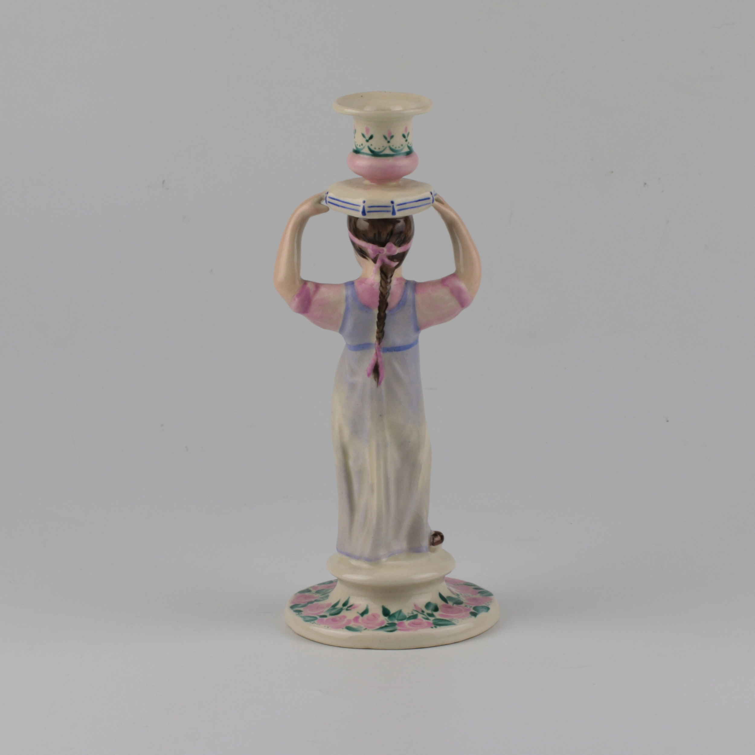 Porcelain candlestick-figure Russian peasant woman.