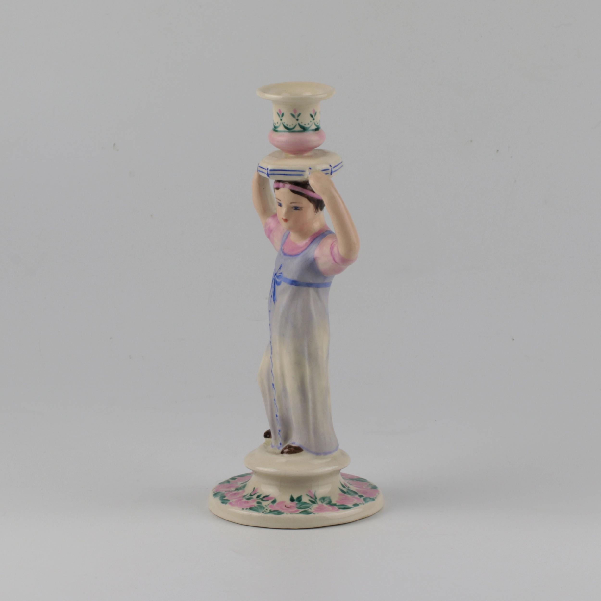 Porcelain candlestick-figure Russian peasant woman.