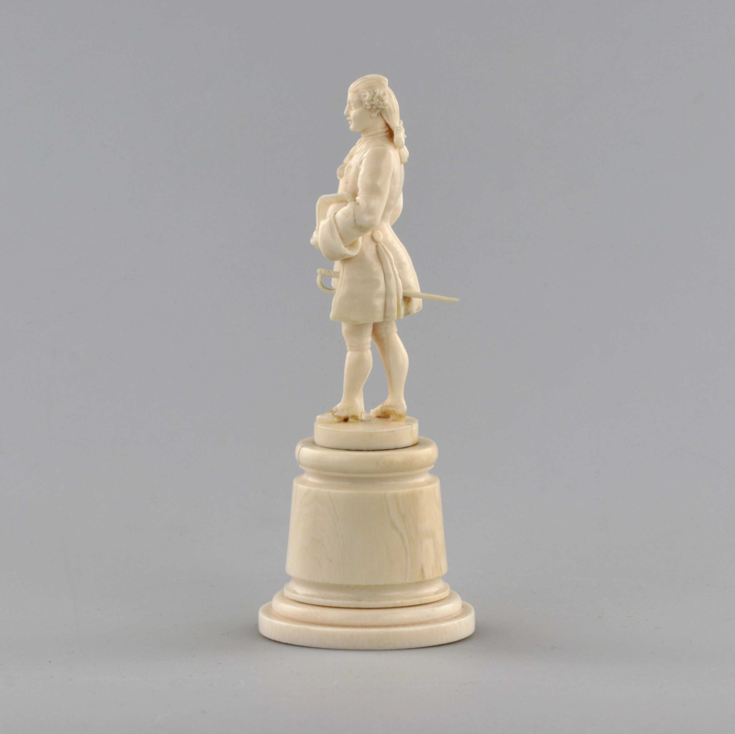 Ivory figure of a gentleman in a cocked hat.
