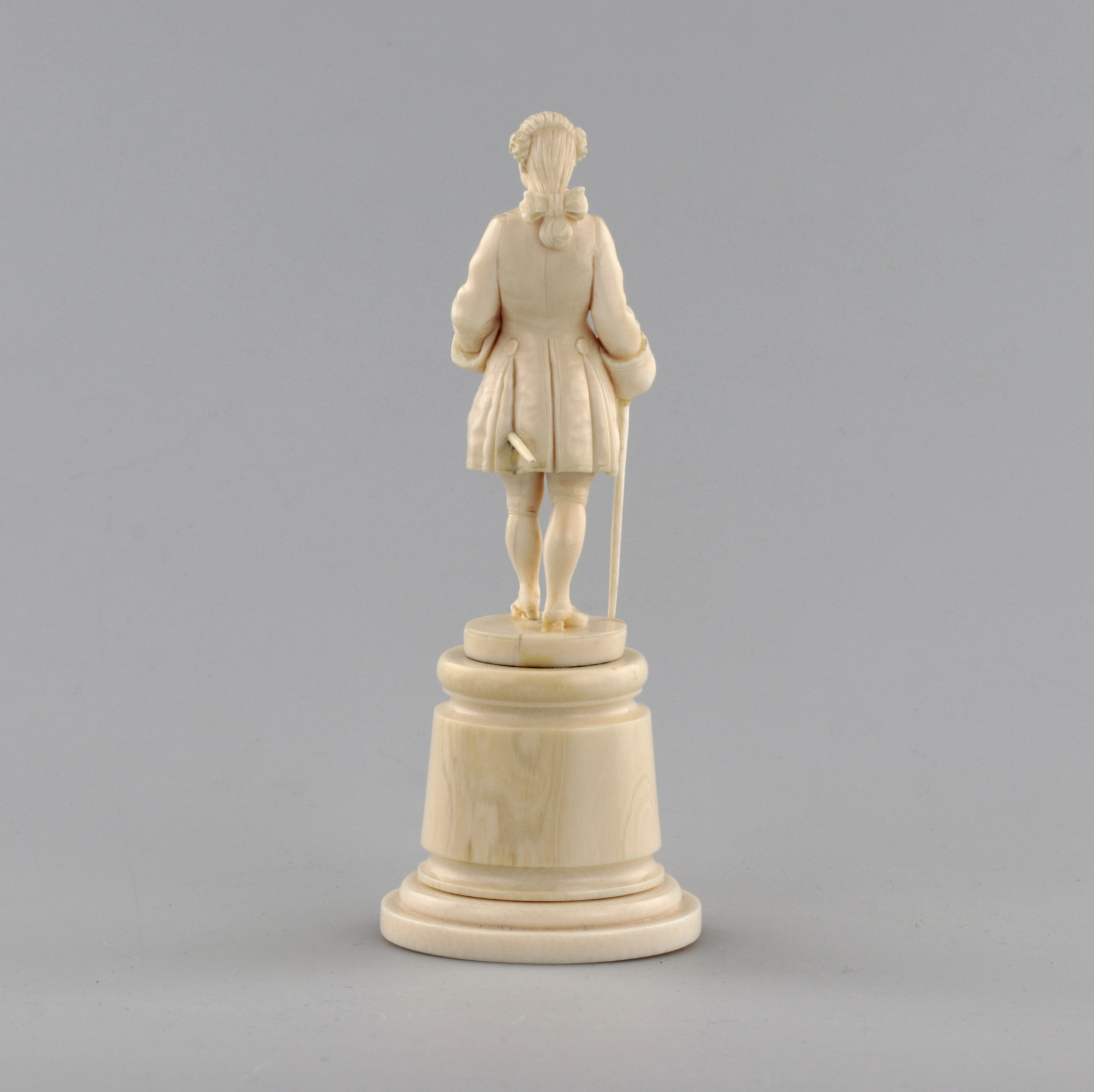 Ivory figure of a gentleman in a cocked hat.