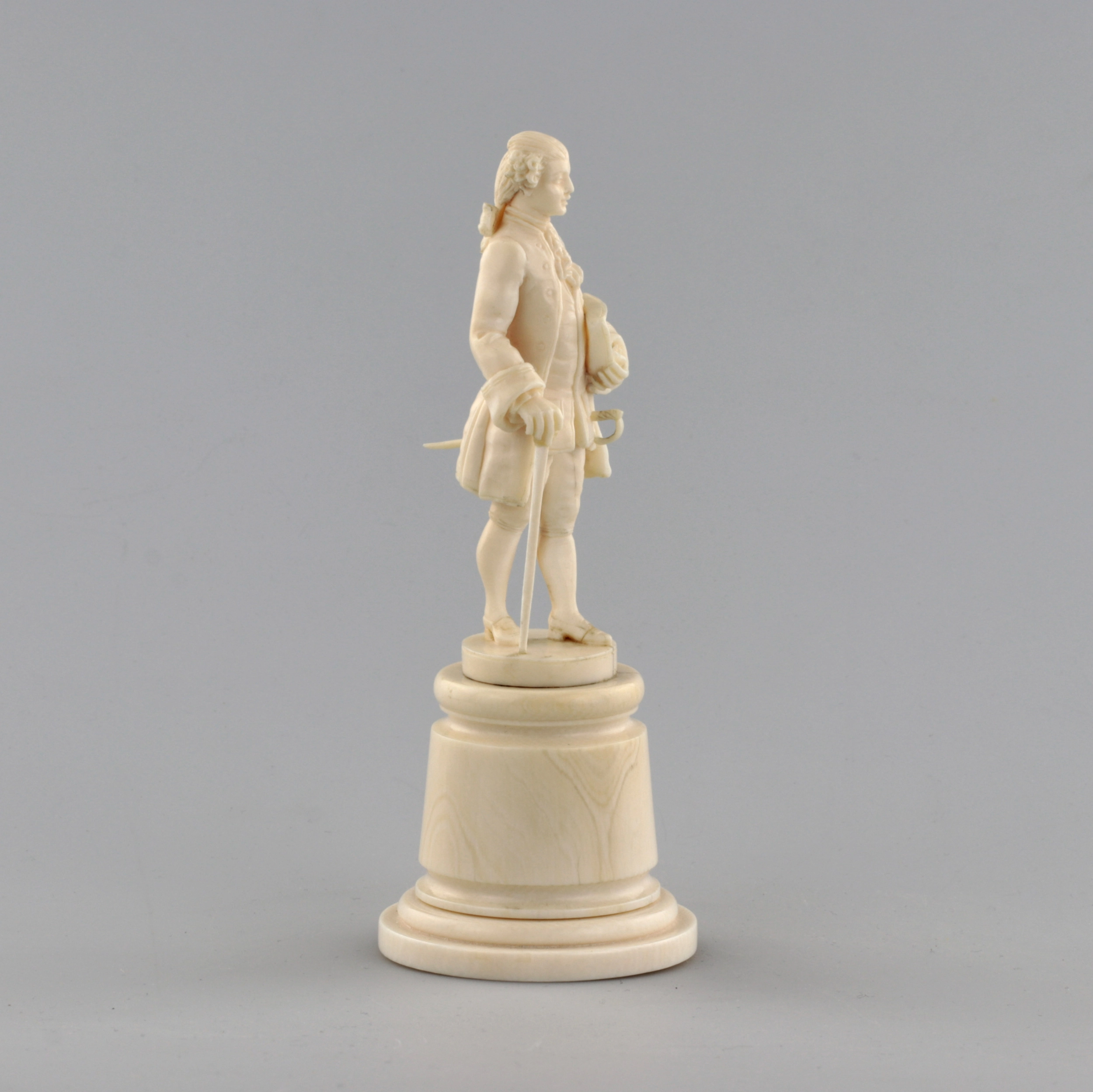 Ivory figure of a gentleman in a cocked hat.