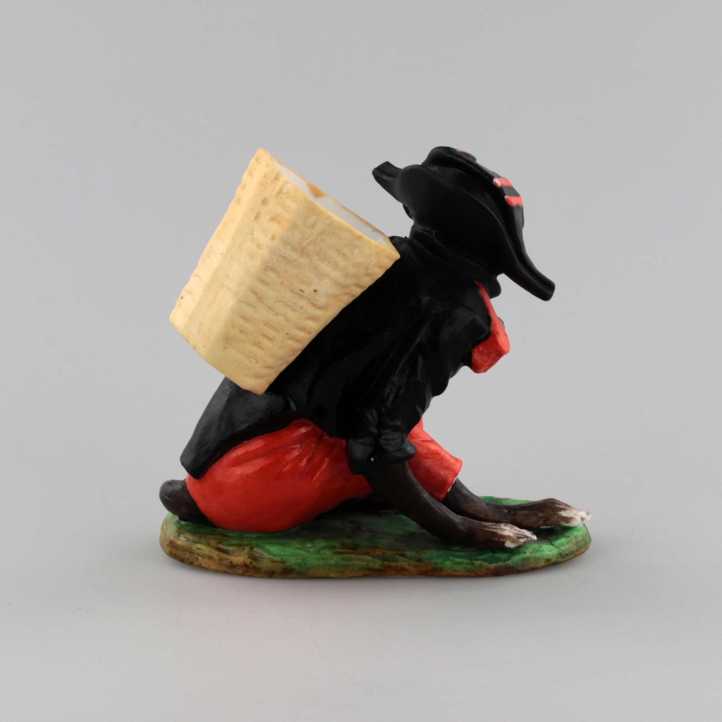 PORCELAIN FIGURE-CONTAINER MONKEY AS NAPOLEON. THURINGIA, GERMANY. LATE 19TH TO EARLY 20TH CENTURY.