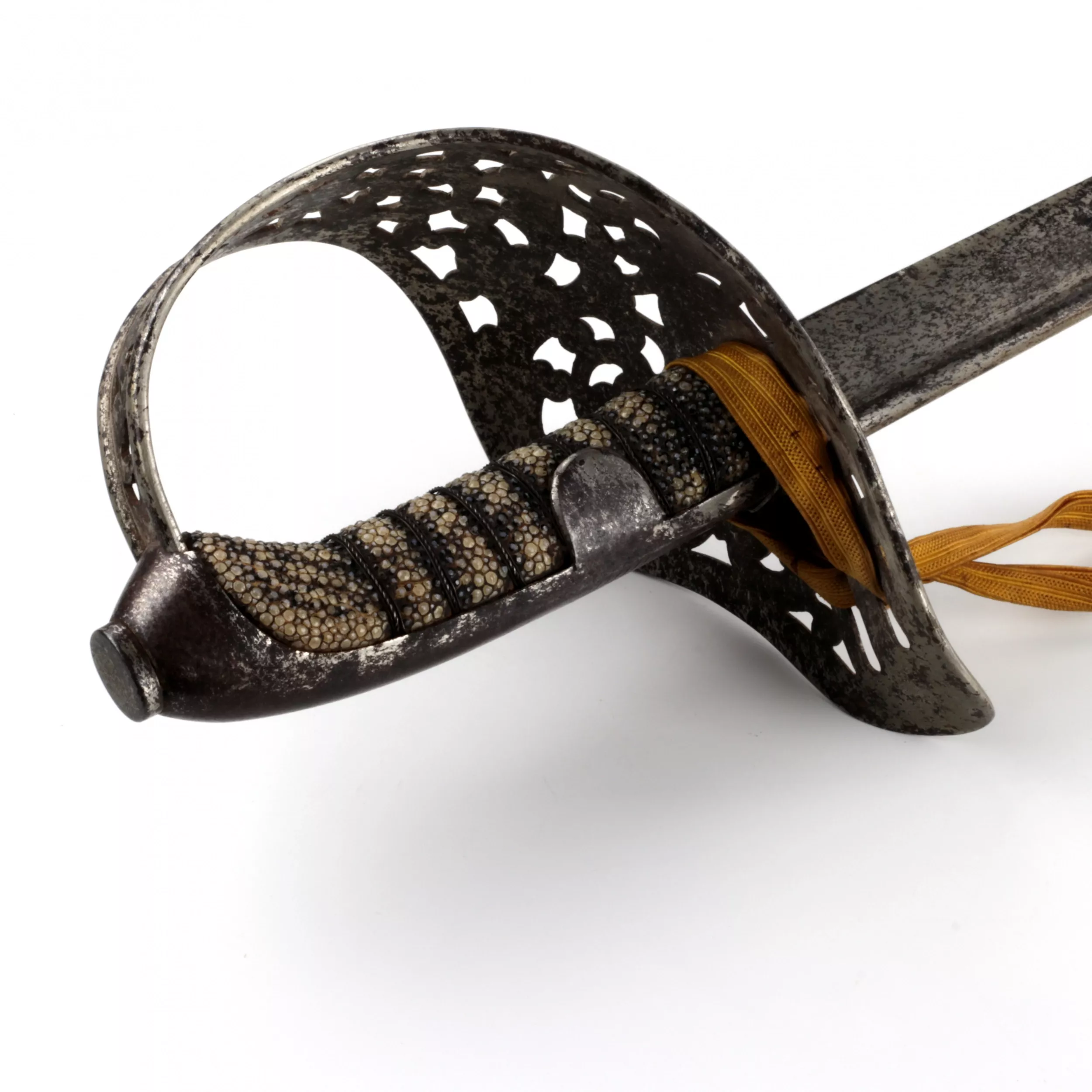 A cavalry broadsword with a carved steel hilt. 