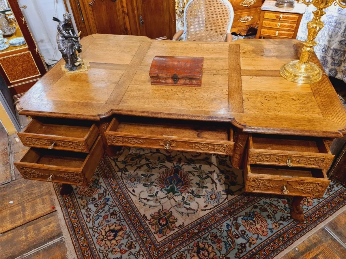 Regency style office table, richly carved. 