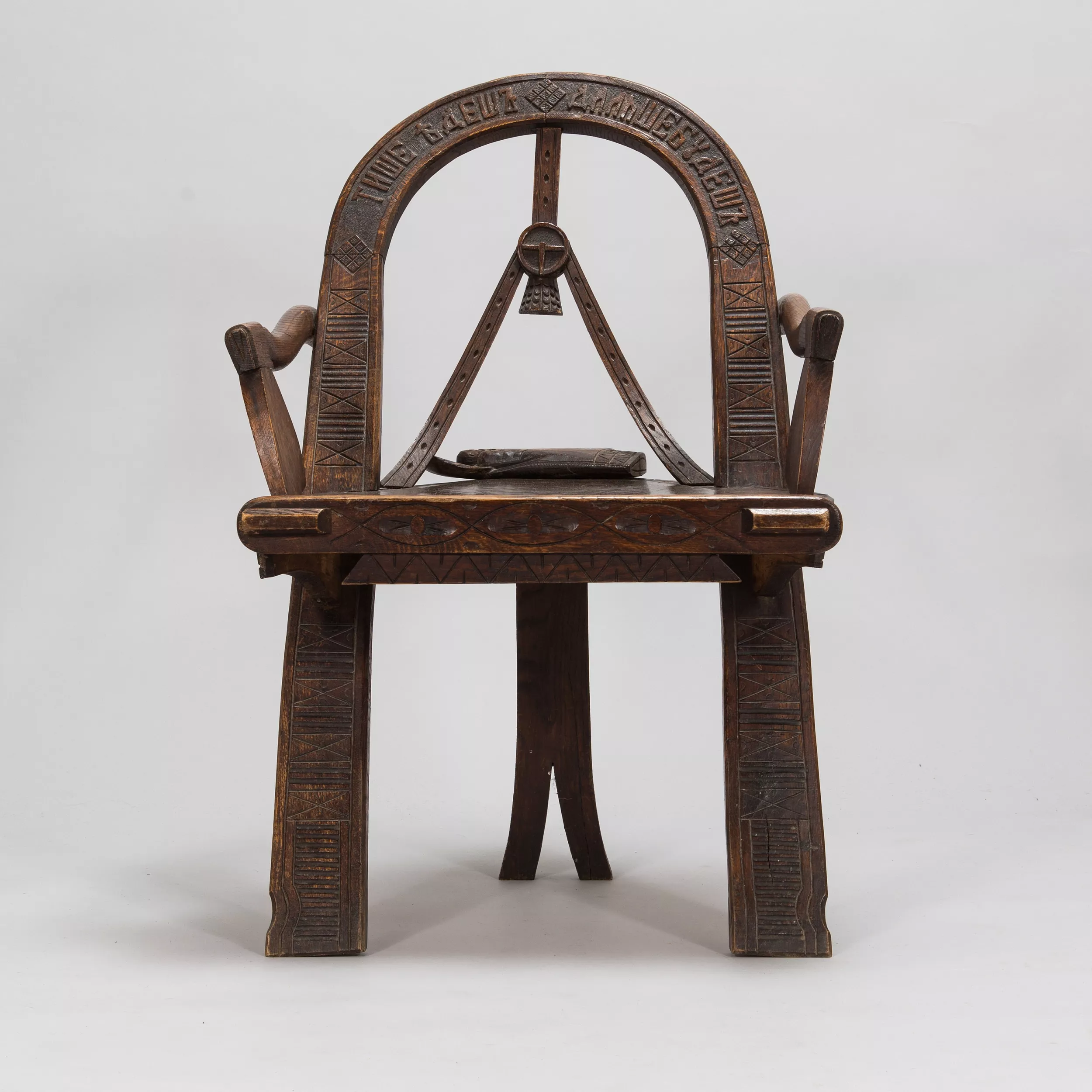 Russian carved armchair Arch, ax and gloves according to the sketch of V.P. Shutov. Russia, late 19th century. 