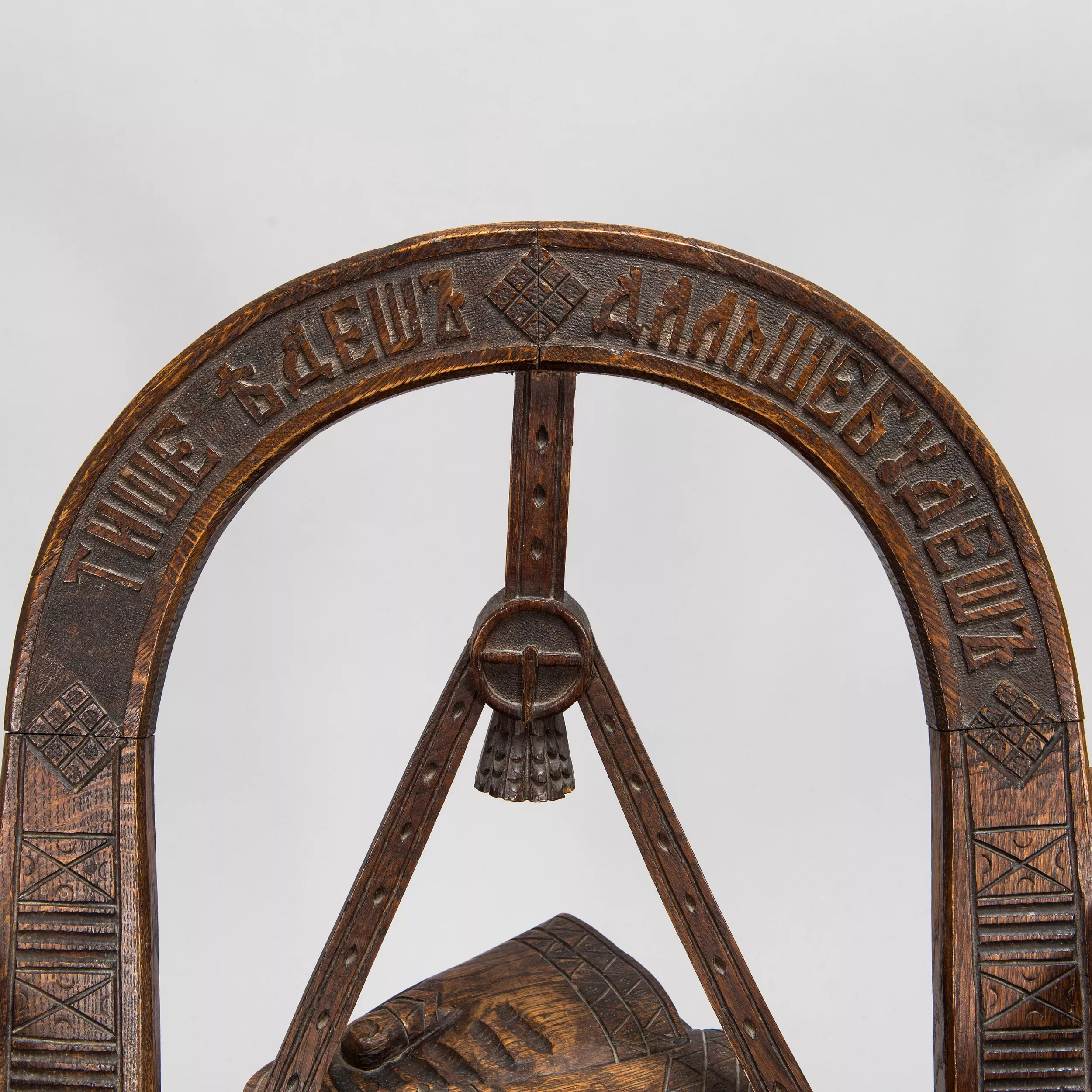 Russian carved armchair Arch, ax and gloves according to the sketch of V.P. Shutov. Russia, late 19th century. 