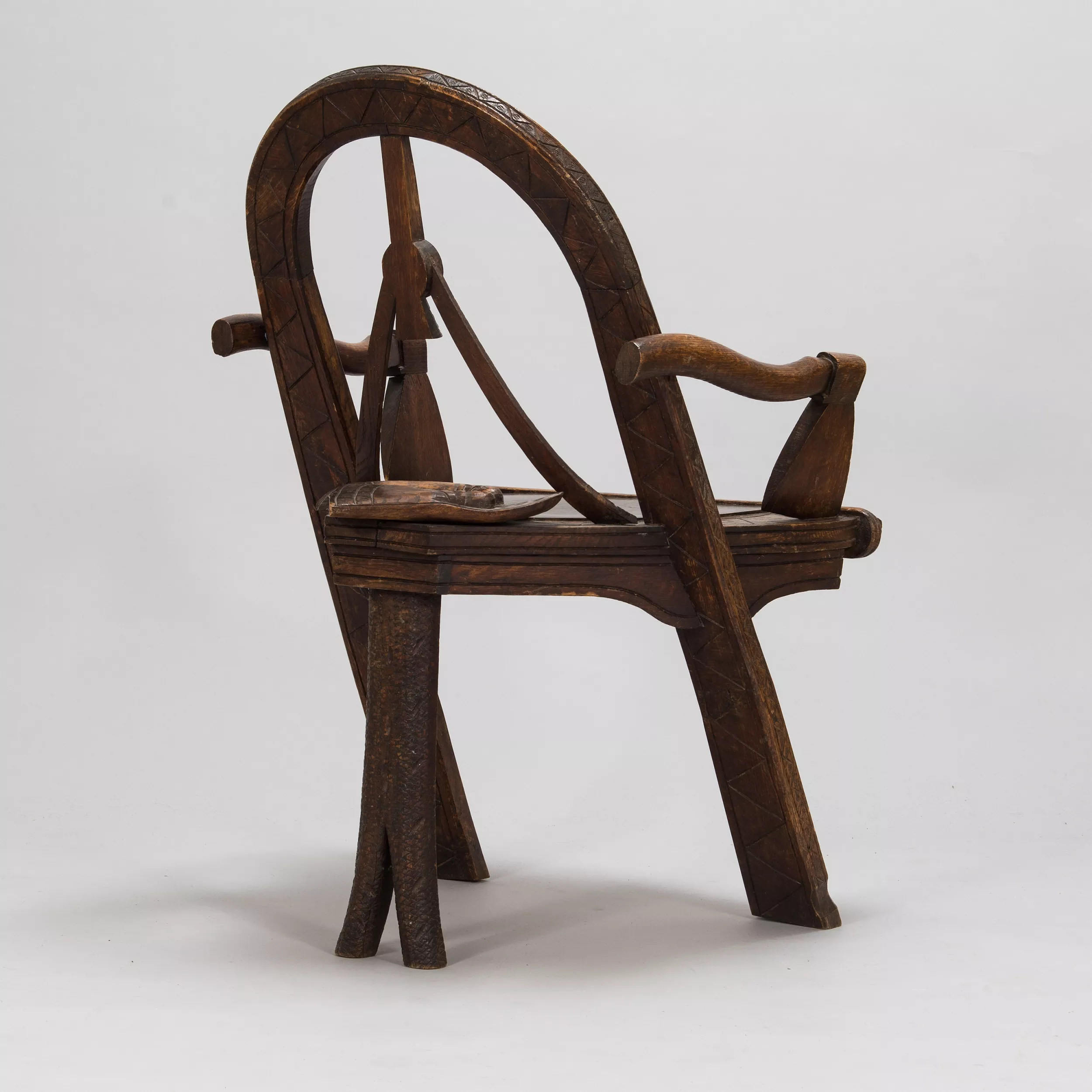 Russian carved armchair Arch, ax and gloves according to the sketch of V.P. Shutov. Russia, late 19th century. 