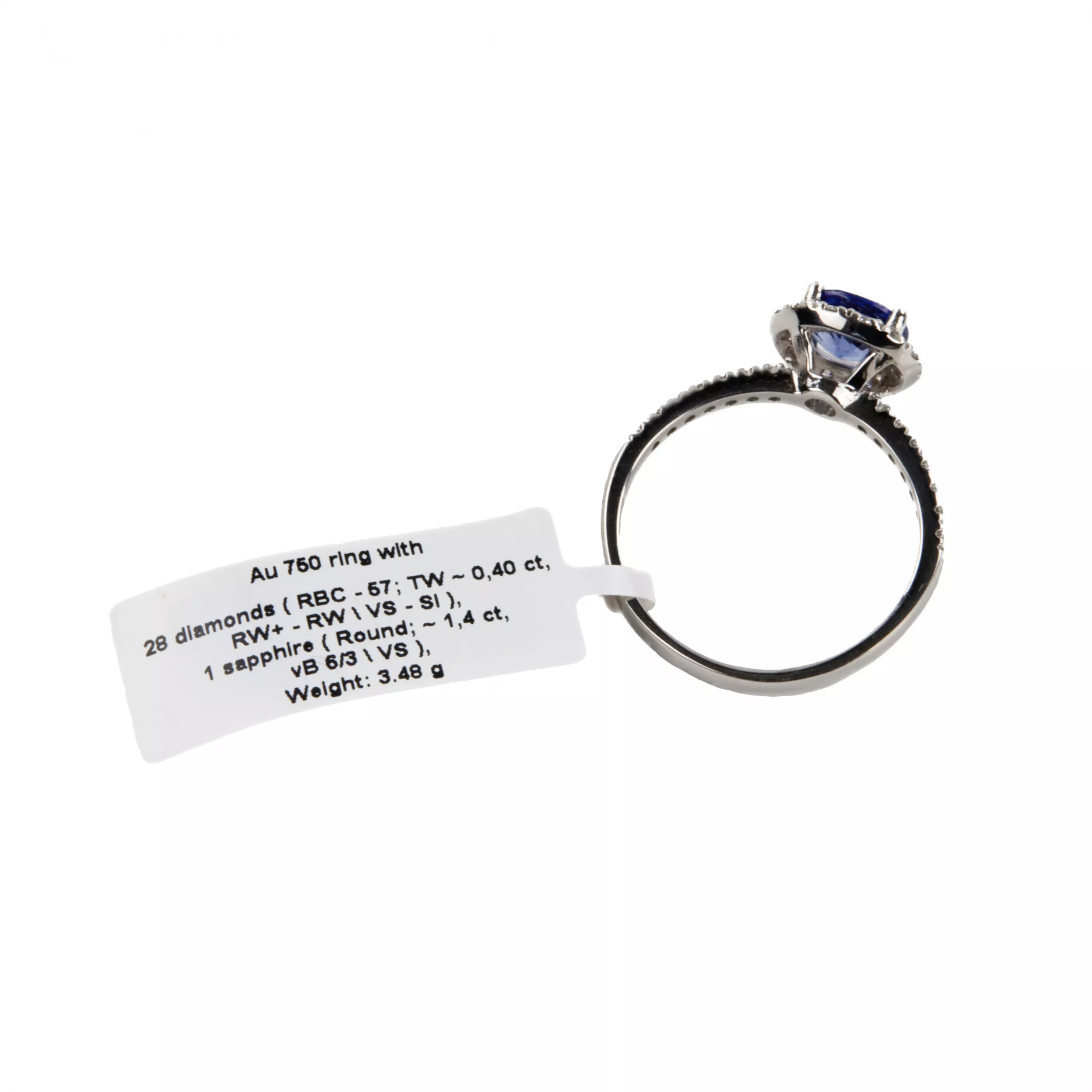 Bague en or blanc avec saphir bleu et diamants. 