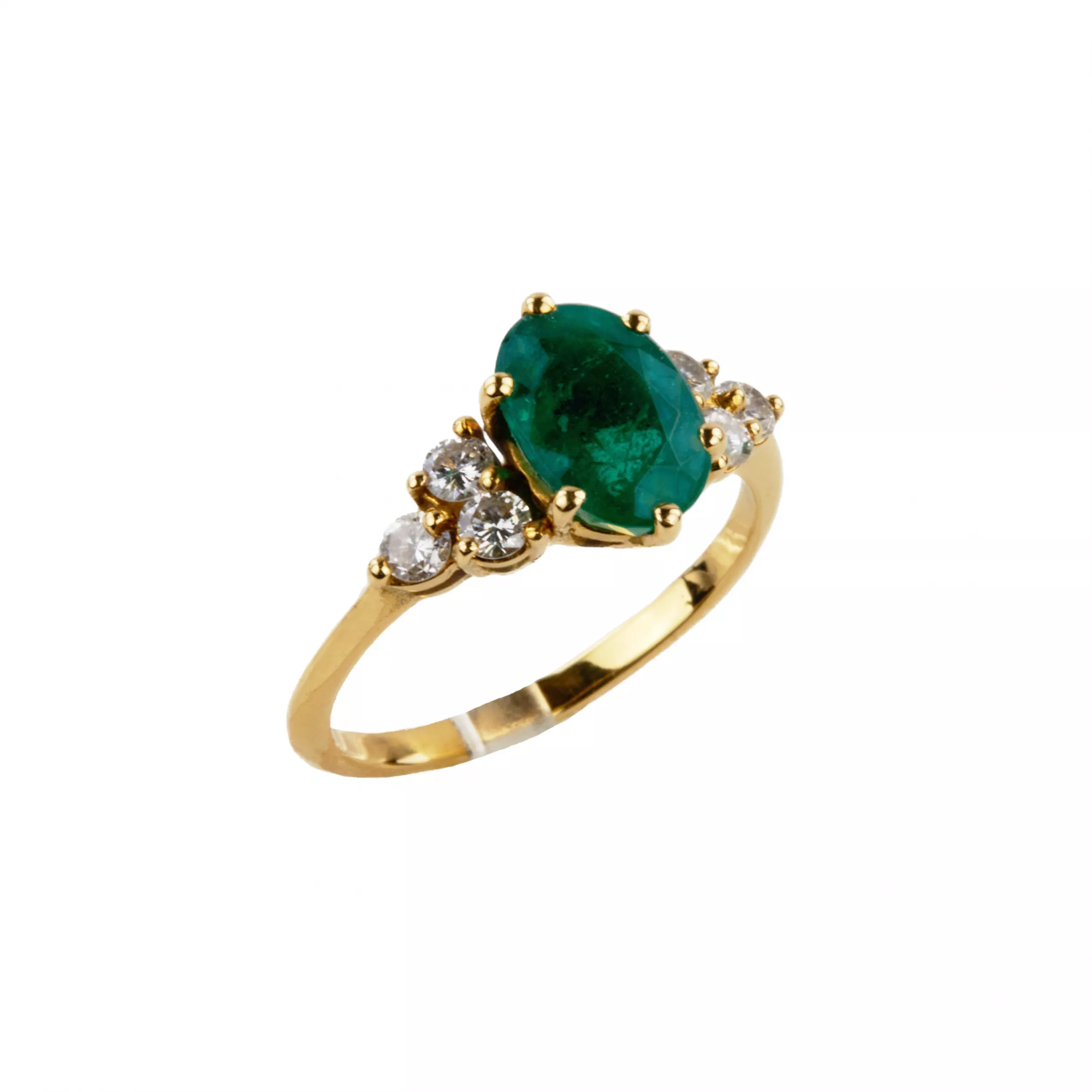 Gold ring with emerald and diamonds. 