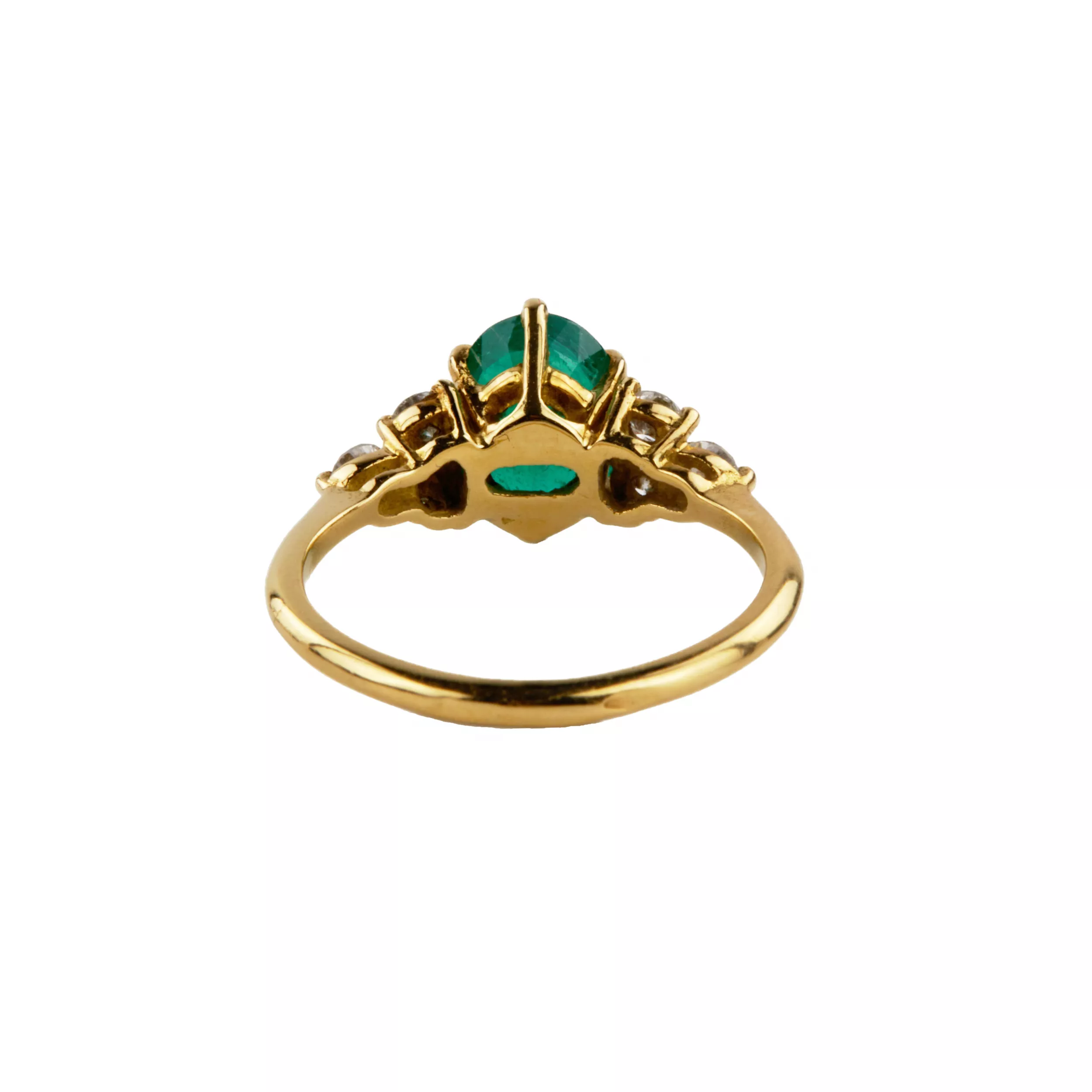 Gold ring with emerald and diamonds. 