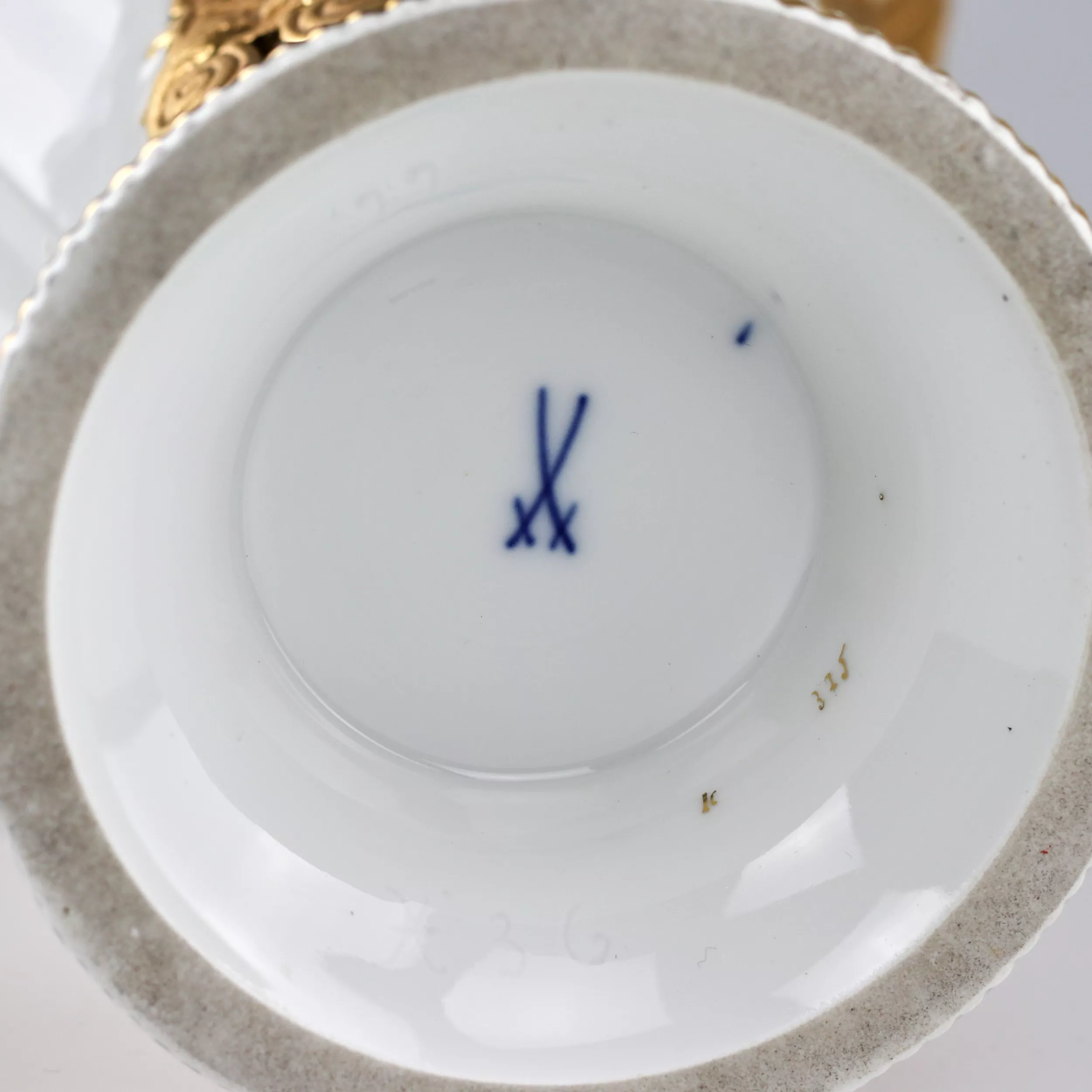 Meissen porcelain vase with golden decor. 