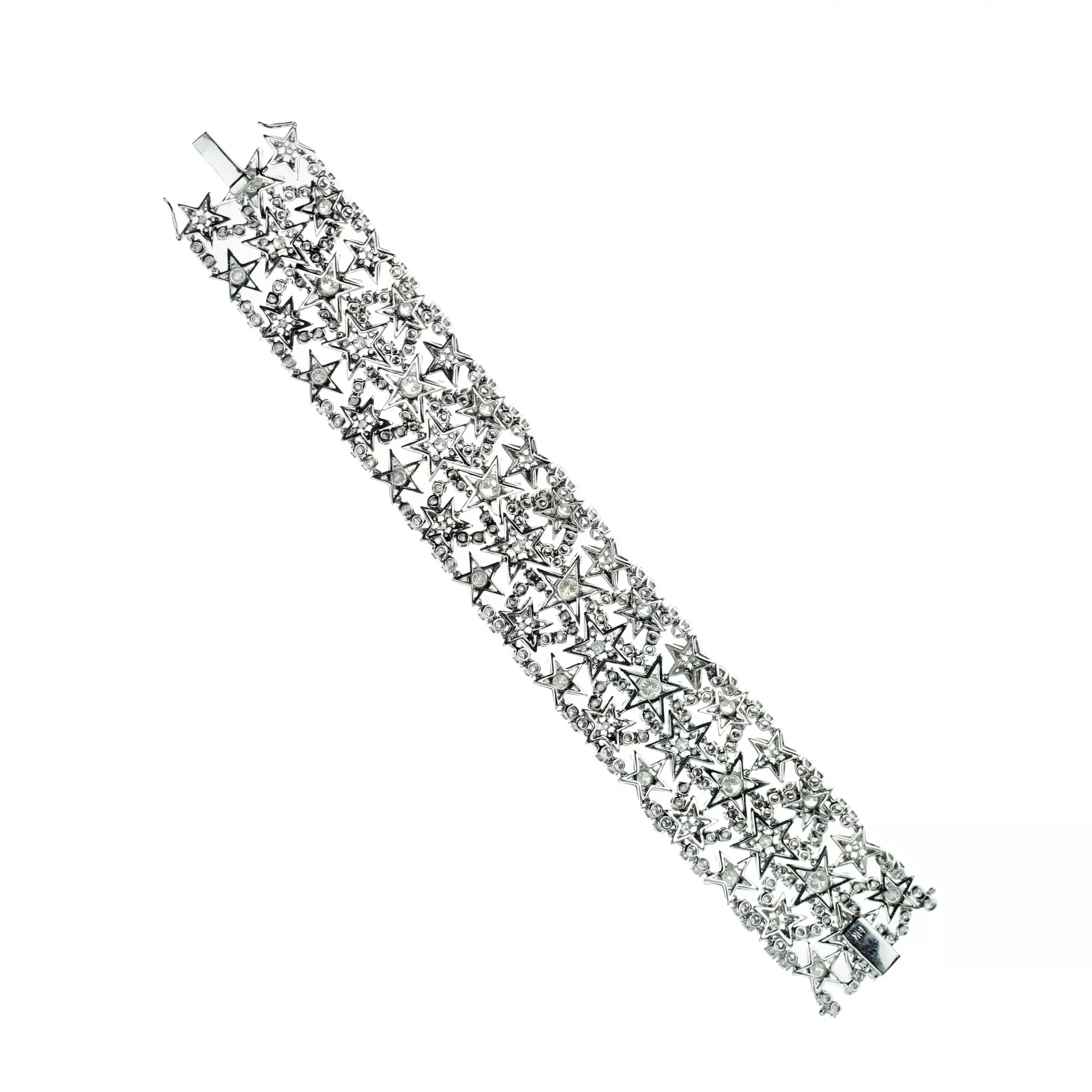 BRACELET LARGE EN OR À MOTIF D’ÉTOILES DIAMANTÉES. EUROPE. XXᵉ SIÈCLE