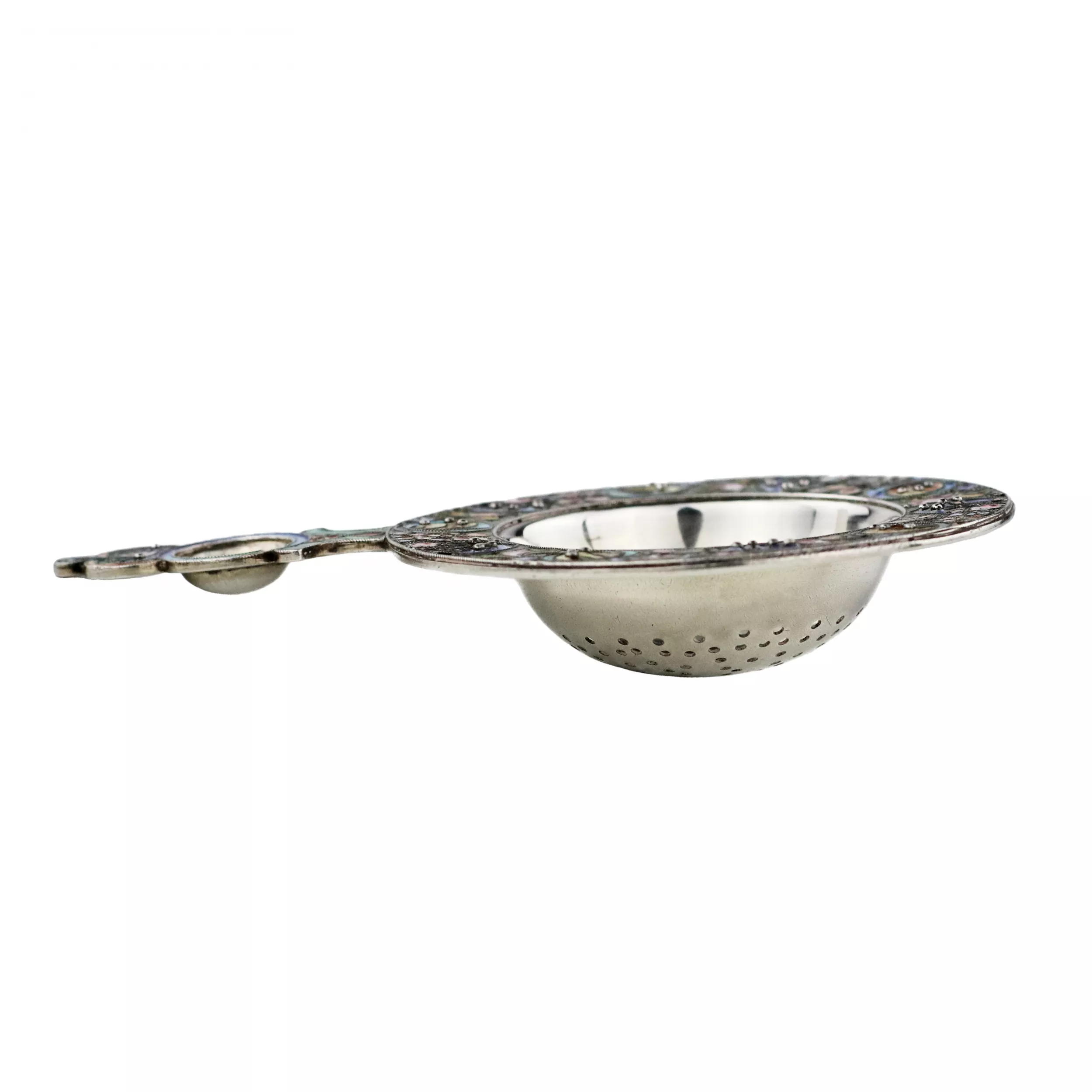 RUSSIAN SILVER TEA STRAINER WITH POLYCHROME ENAMEL DECORATION IN THE RUSSIAN ART NOUVEAU STYLE. MOSCOW, 11TH ARTEL, 1908–1917