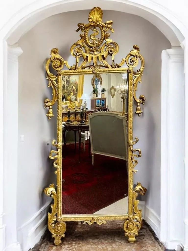 Rare 18th century gilded wood mirror, Italy