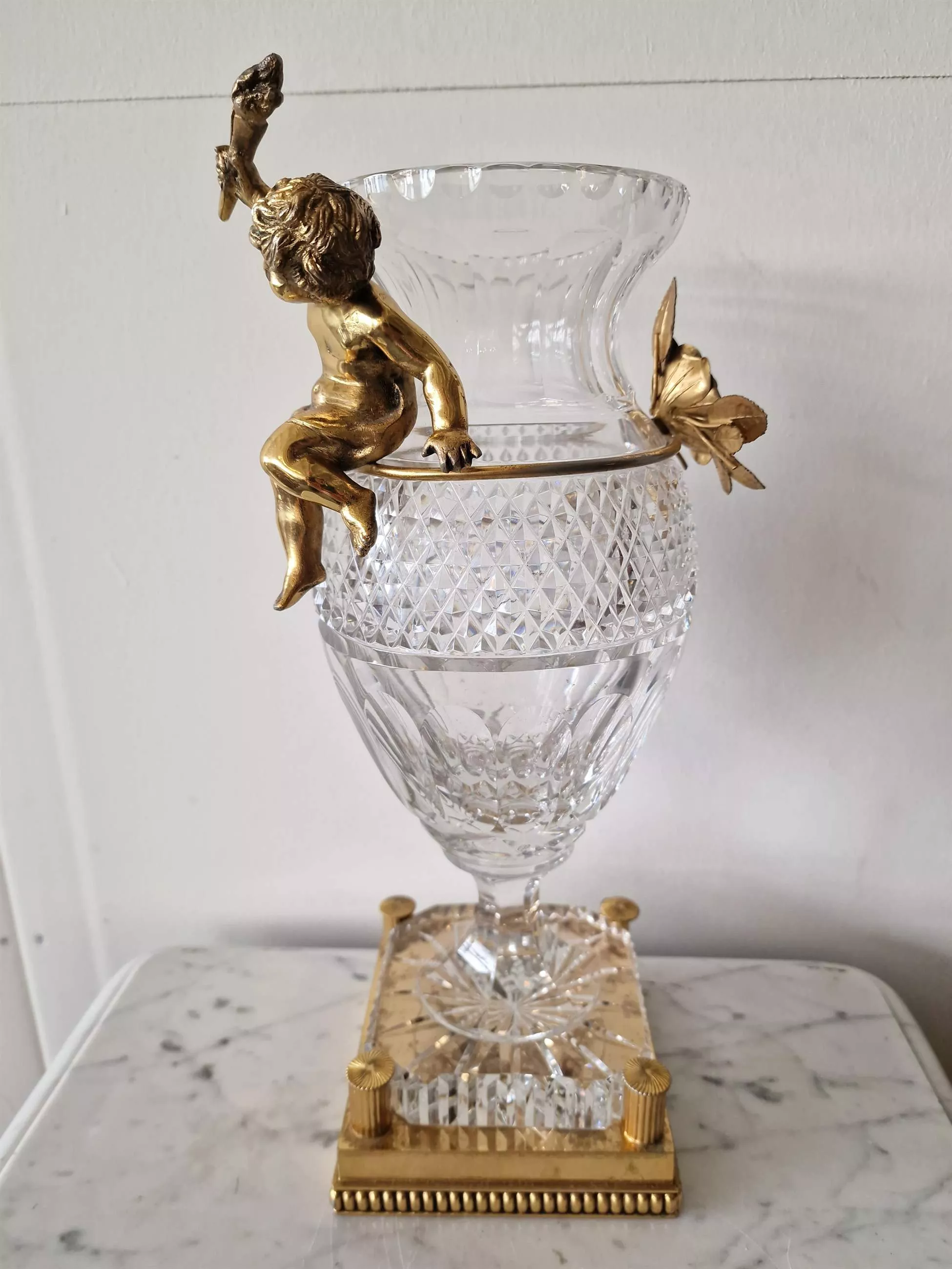 Bohemian crystal vase with bronze puti.