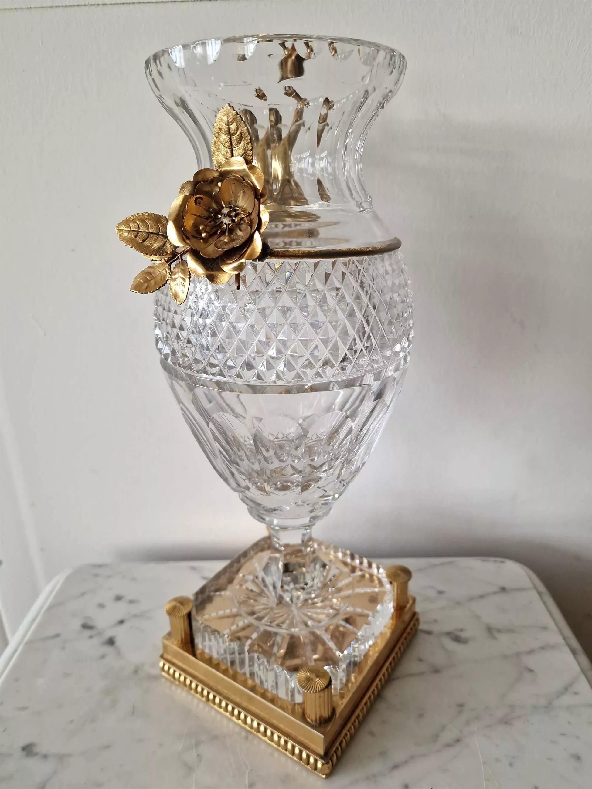 Bohemian crystal vase with bronze puti.