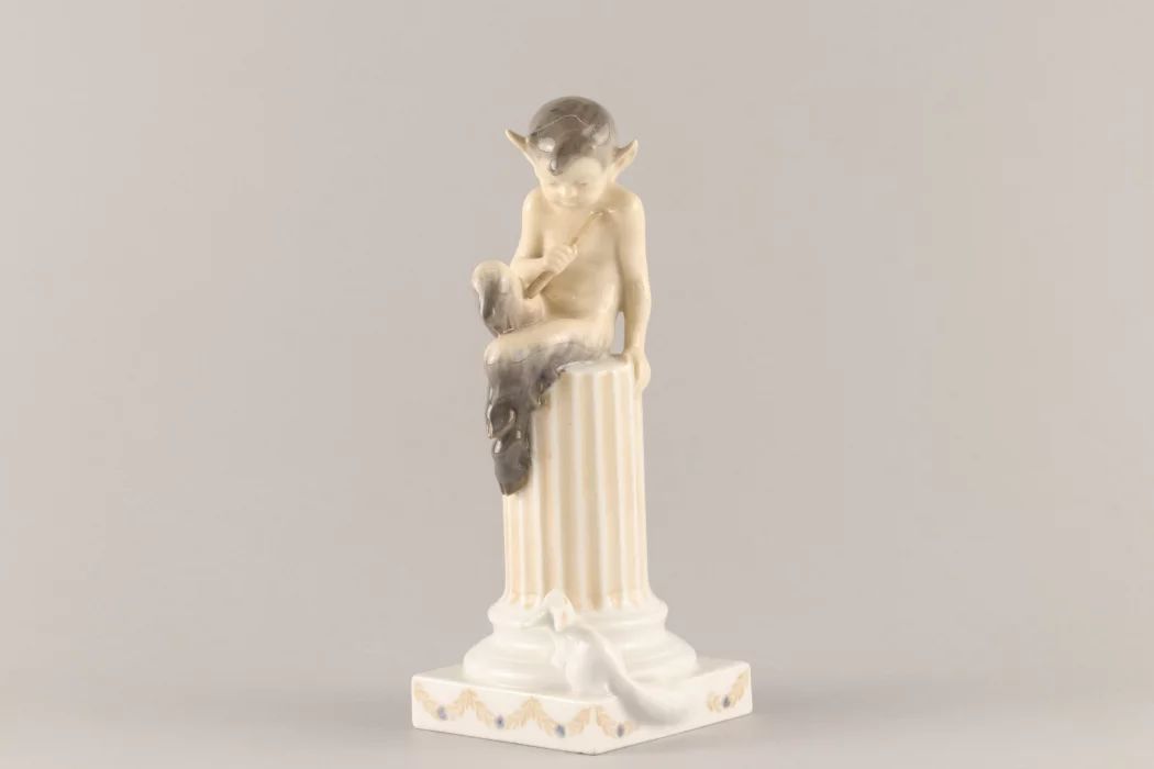 Figurine "Faun on a pedestal with a squirrel". Royal Copenhagen