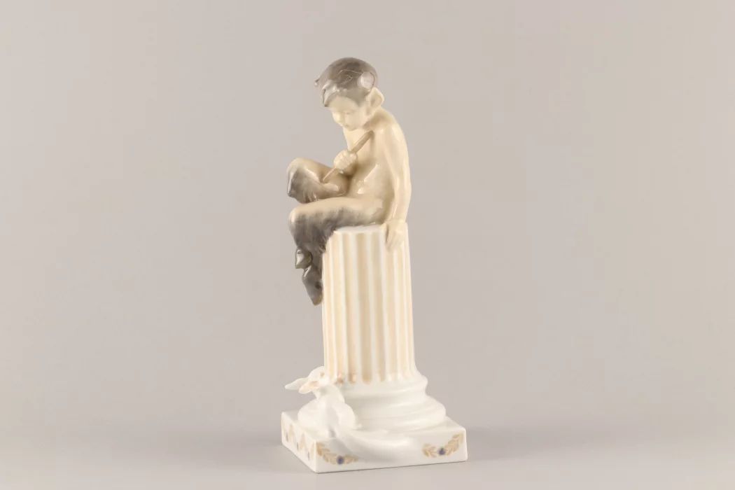 Figurine "Faun on a pedestal with a squirrel". Royal Copenhagen