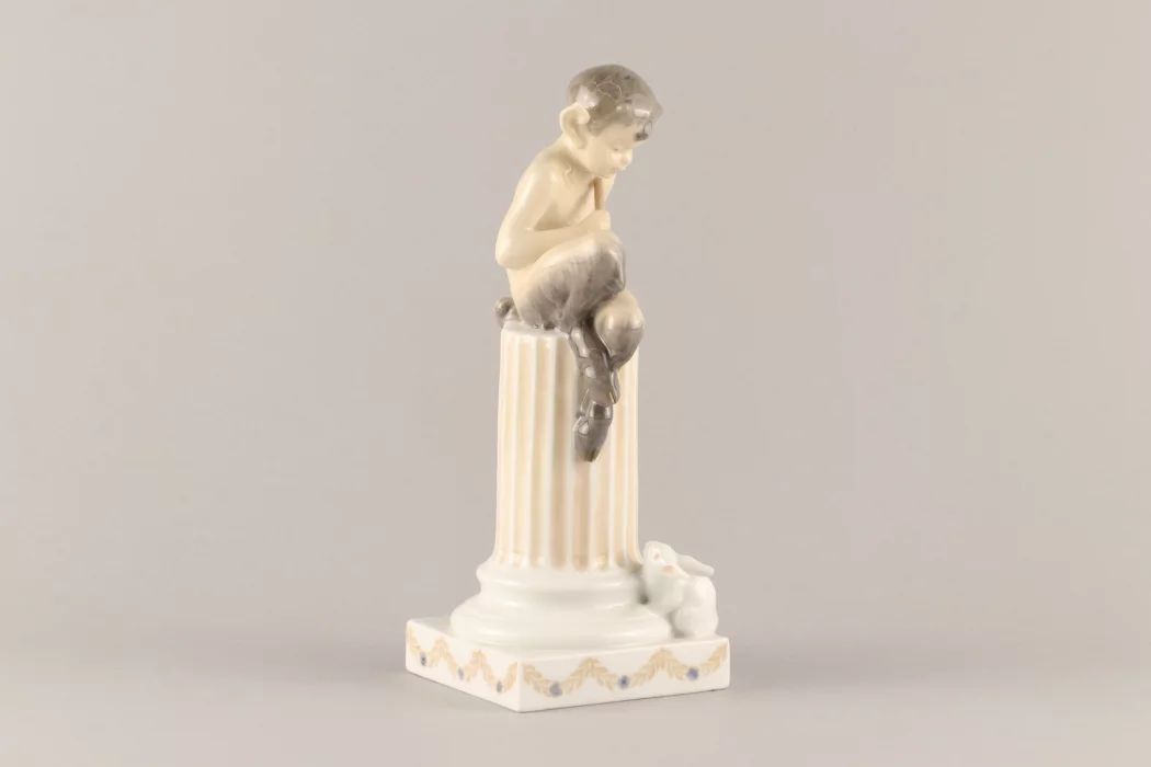 Figurine "Faun on a pedestal with a squirrel". Royal Copenhagen
